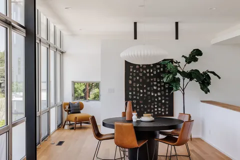 a work room with furniture and a potted plant