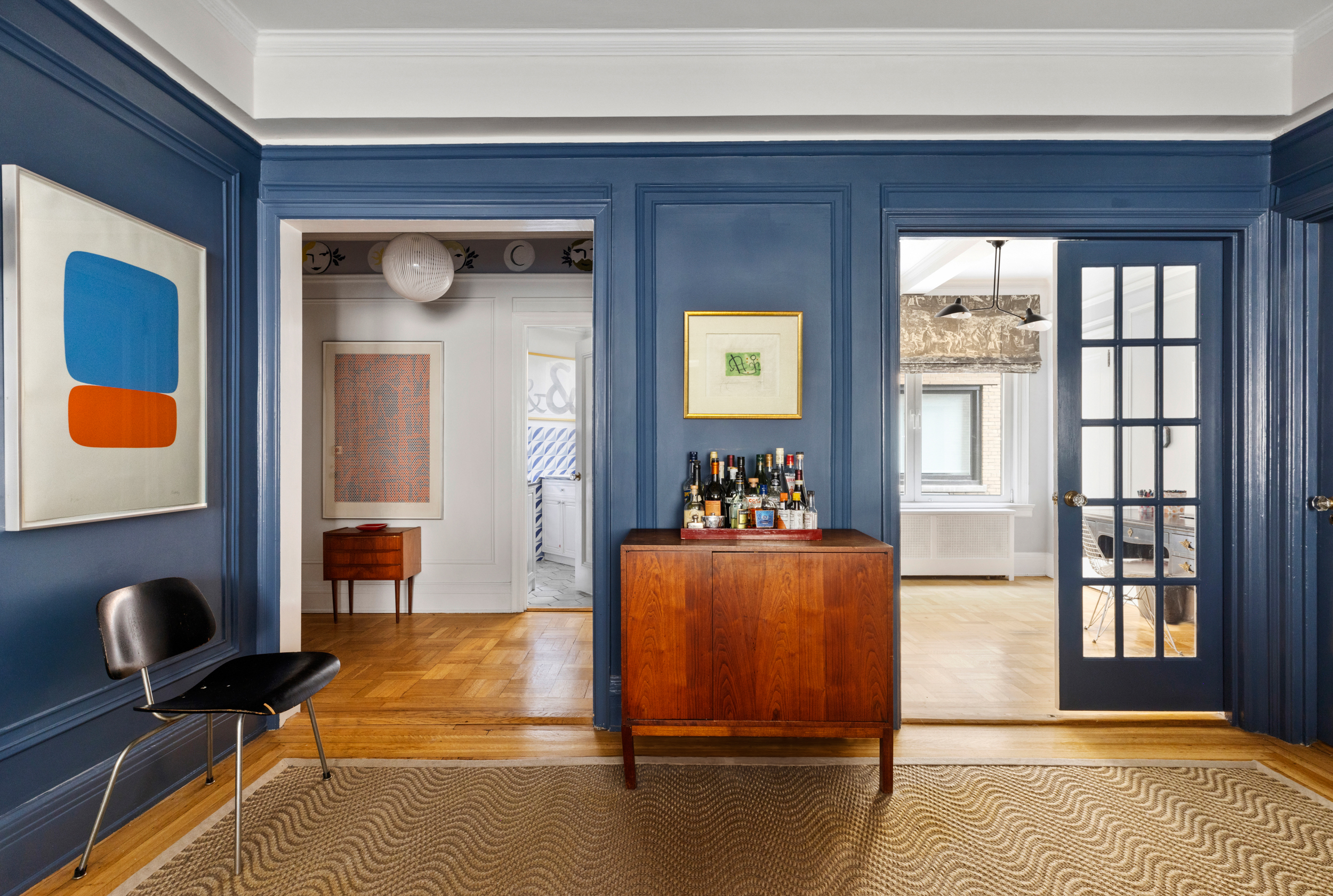 38 East 85th Street, Unit 10E Manhattan, NY 10028 - Photo 2 of 14 a living room with furniture and a window