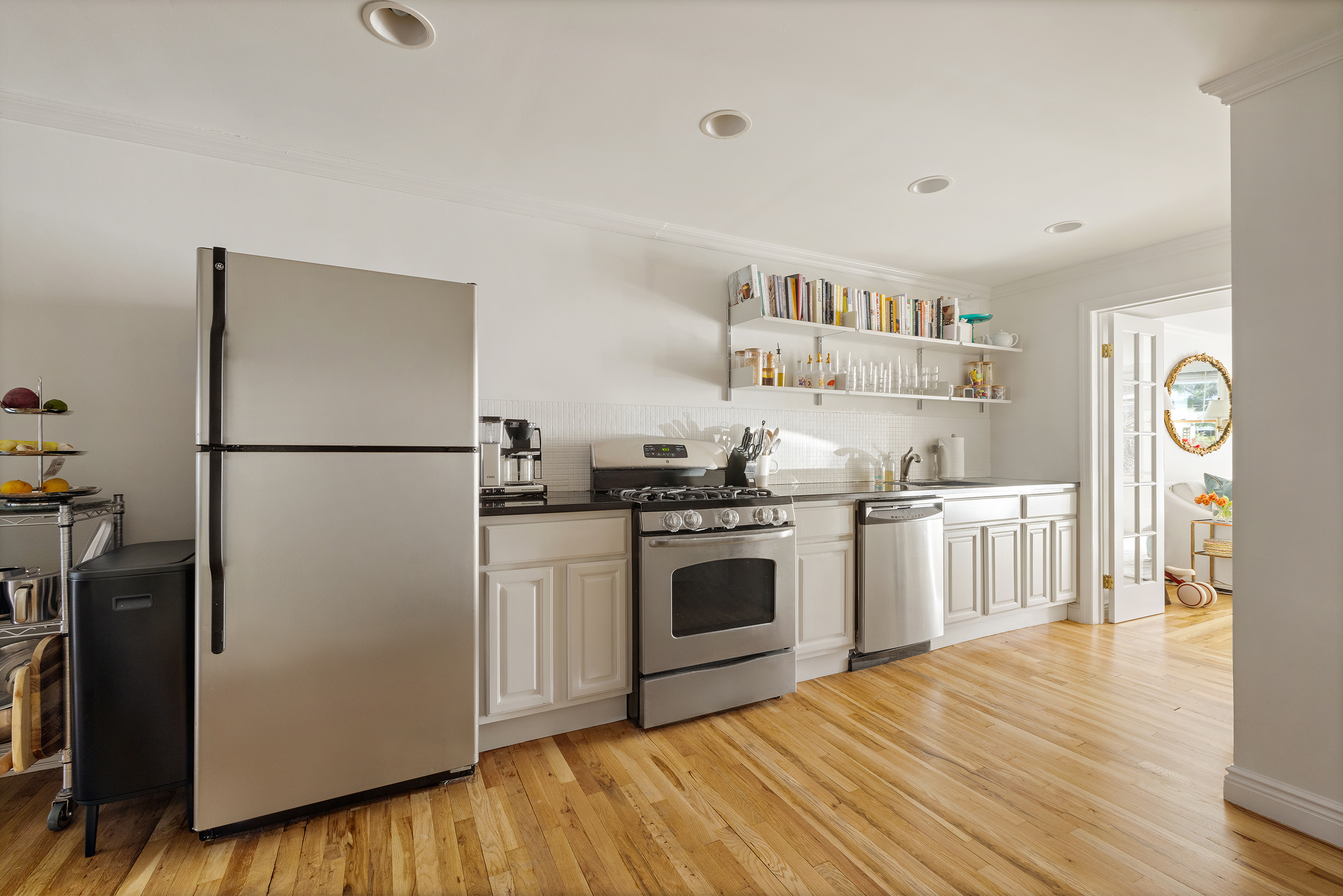 16 Strong Place Brooklyn, NY 11231 - Photo 4 of 19 a kitchen with stainless steel appliances granite countertop a refrigerator and a stove top oven