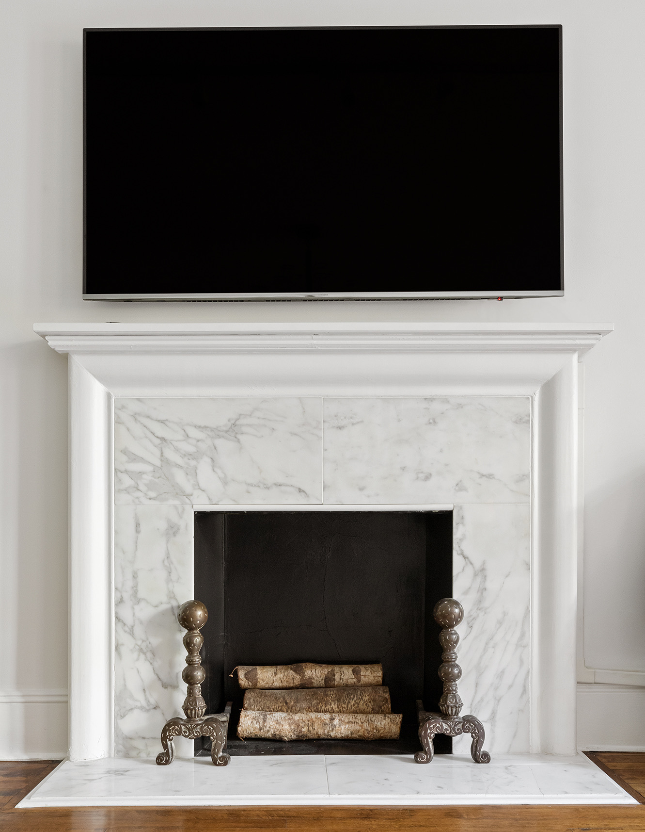 209 East 61st Street Manhattan, NY 10065 - Photo 19 of 27 a living room with a fireplace