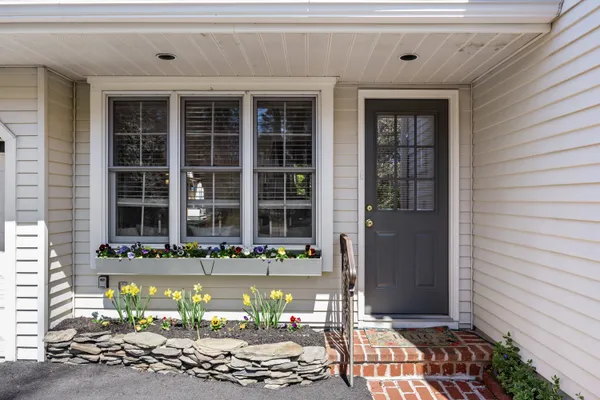 a front view of a house with a large window