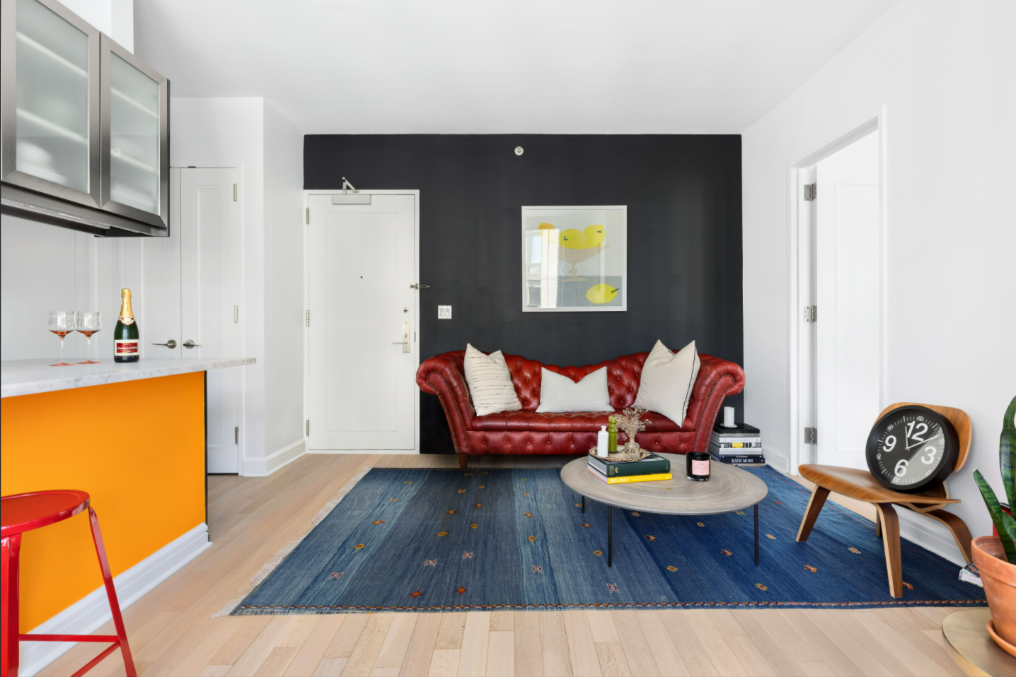 80 Riverside Boulevard, Unit 12D Manhattan, NY 10069 - Photo 2 of 16 a living room with furniture and a table