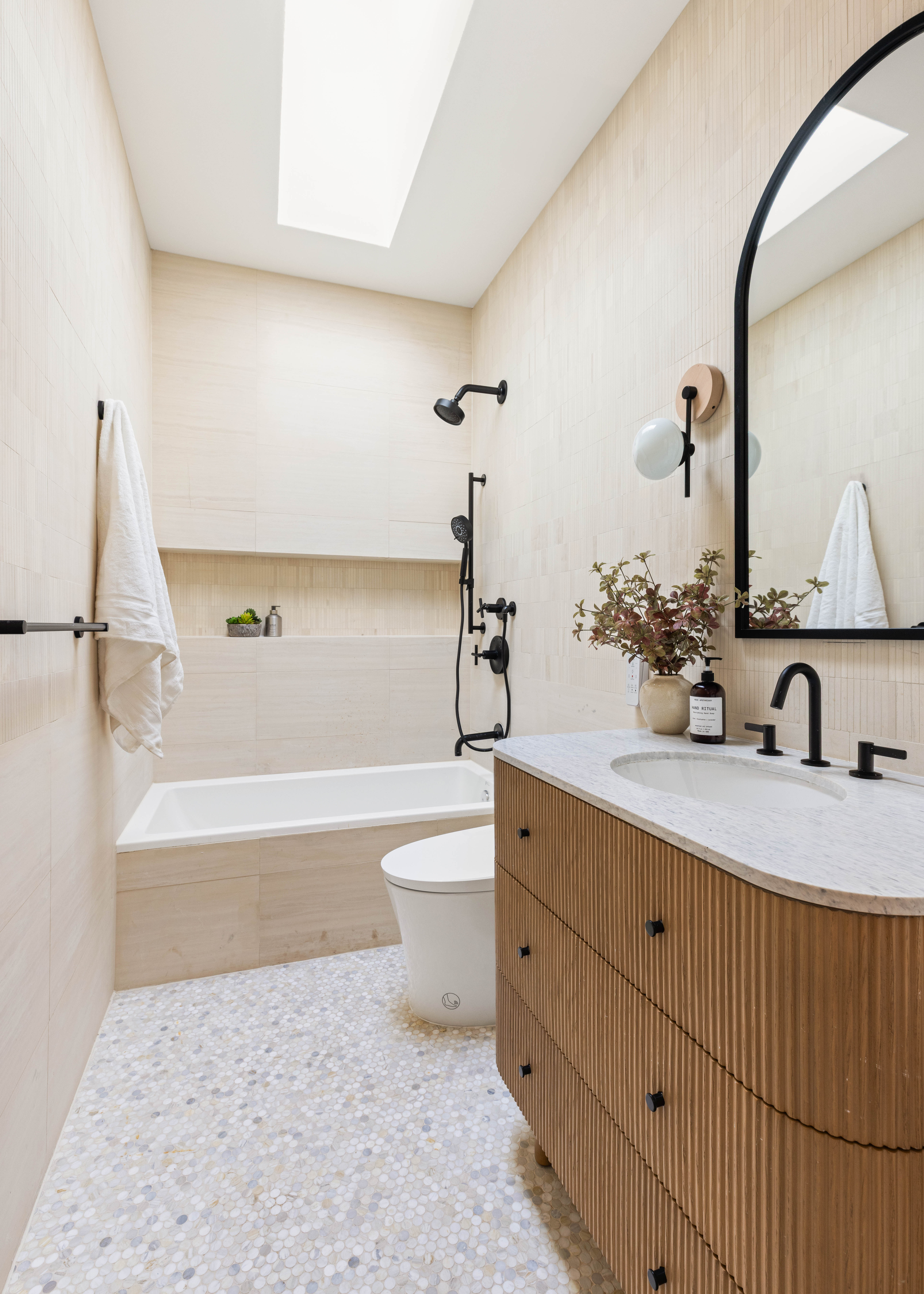 196 Monroe Street Brooklyn, NY 11216 - Photo 13 of 22 a bathroom with a sink a toilet and bathtub