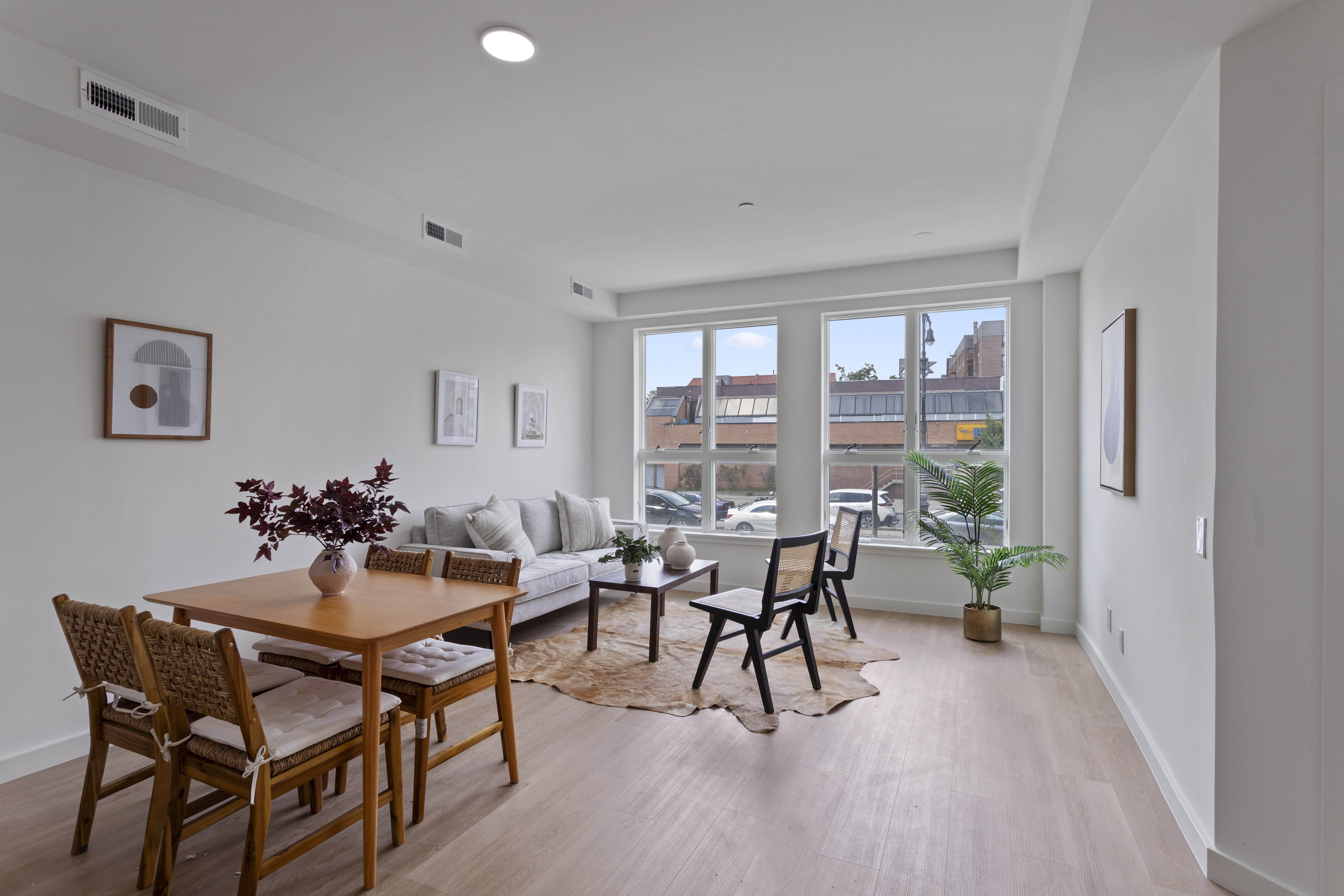 3112 Emmons Avenue, Unit 104 Brooklyn, NY 11235 - Photo 3 of 12 a view of a dining room with furniture and wooden floor