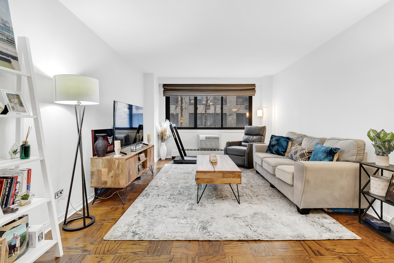 16 West 16th Street, Unit 2LN Manhattan, NY 10011 - Photo 1 of 11 a living room with furniture and a window