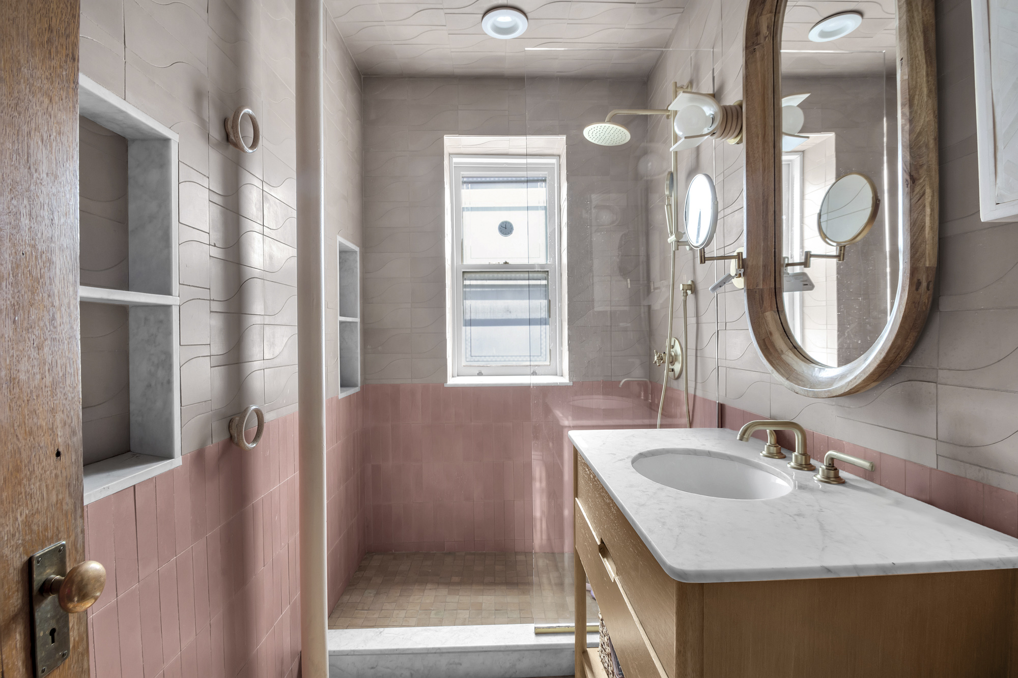275 Clinton Avenue, Unit 4-1 Brooklyn, NY 11205 - Photo 12 of 20 a bathroom with a sink and a mirror