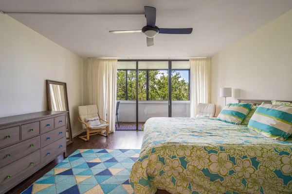 a bedroom with a bed and a dresser