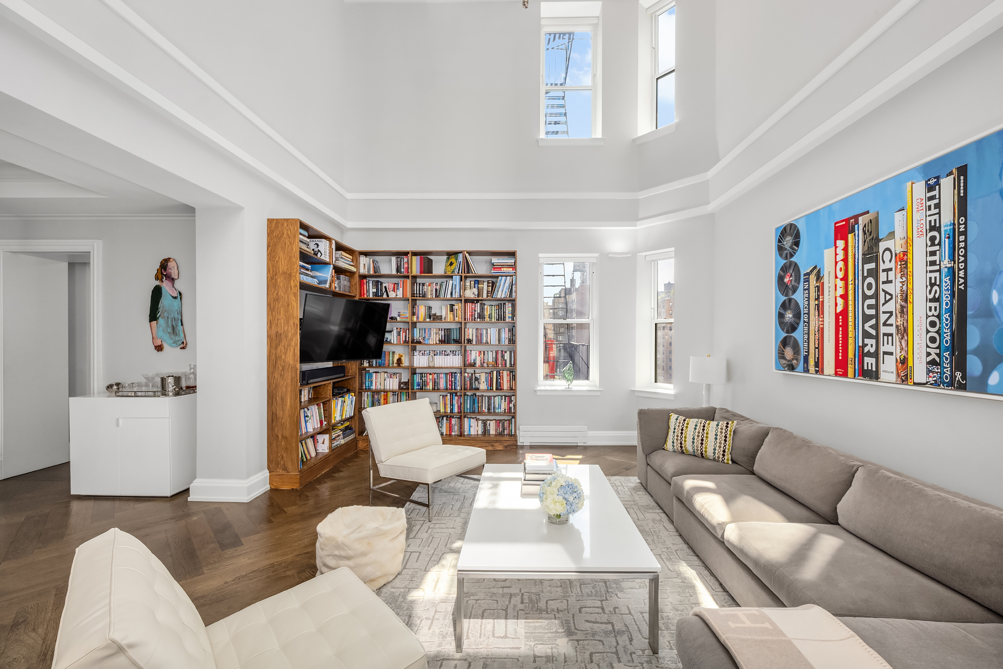 344 West 72nd Street, Unit 1007 Manhattan, NY 10023 - Photo 2 of 23 a living room with furniture and a flat screen tv