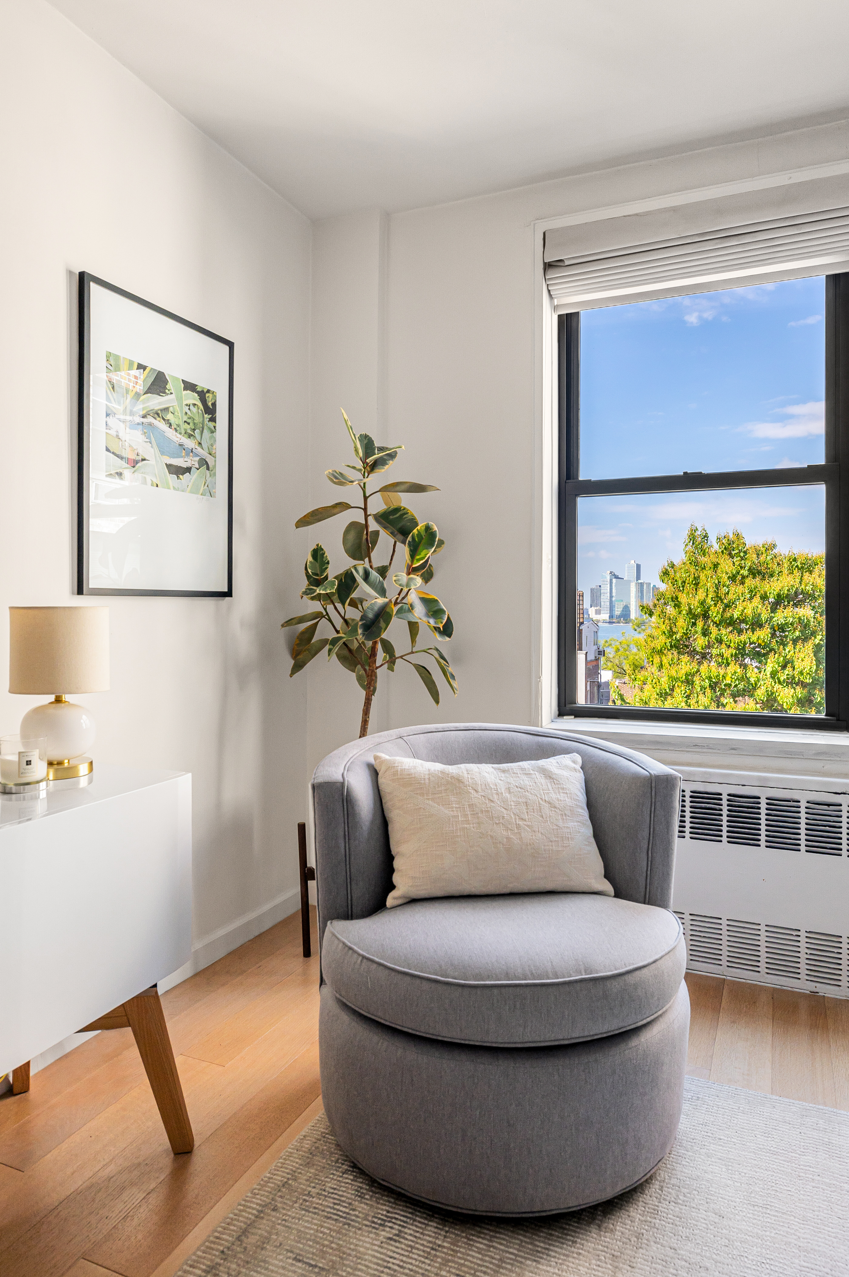 165 Christopher Street, Unit 5DD Manhattan, NY 10014 - Photo 2 of 15 a picture of a couch in a room