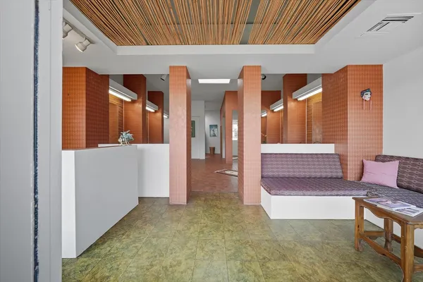 a view of a livingroom with furniture and windows