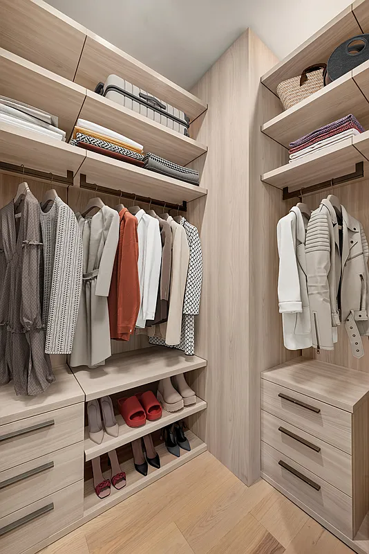 1059 3rd Avenue, Unit 10C Manhattan, NY 10065 - Photo 6 of 7 a view of walk in closet with clothes and shoes