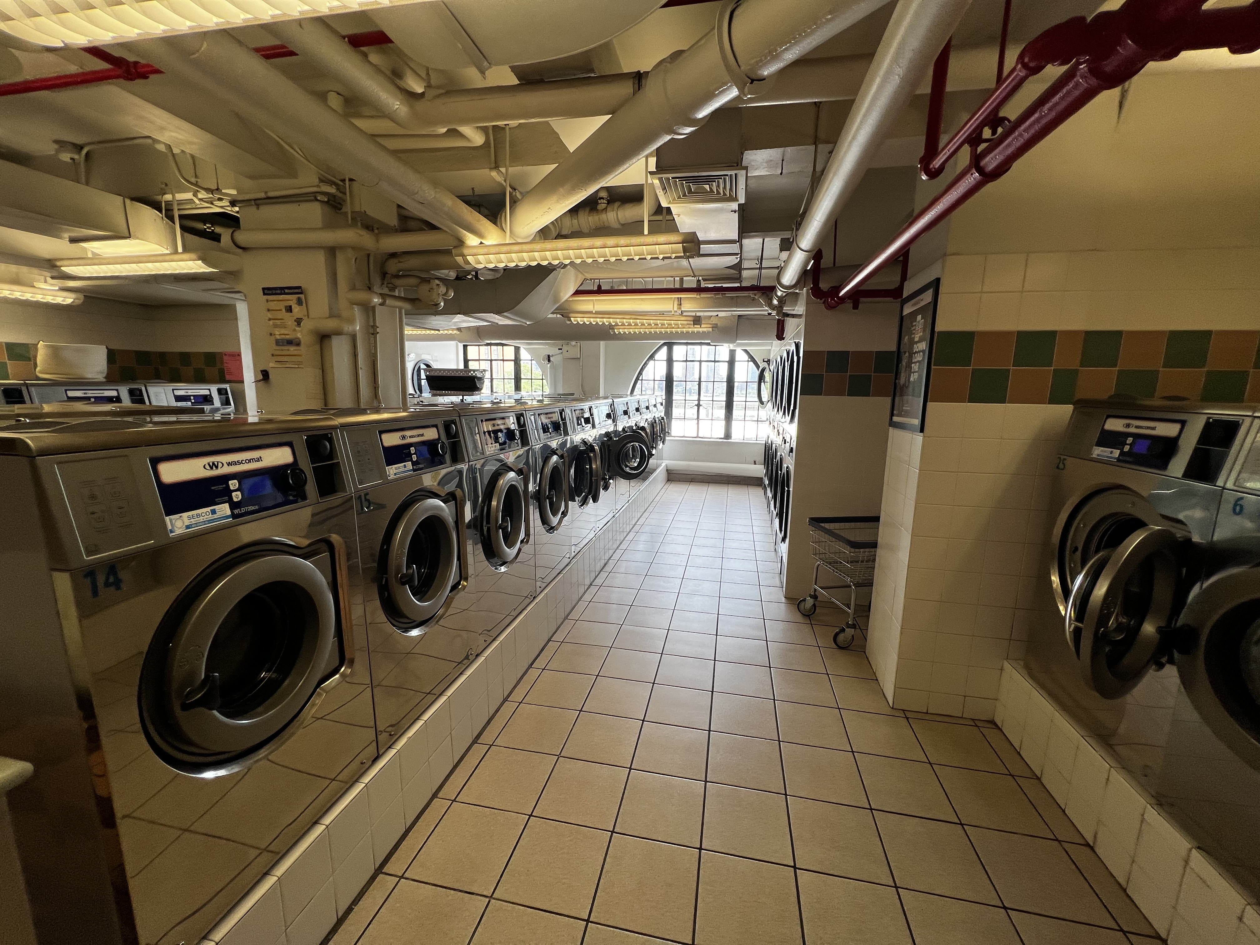 5 Tudor City Place, Unit 1536 Manhattan, NY 10017 - Photo 20 of 21 a utility room with dryer washer and other items