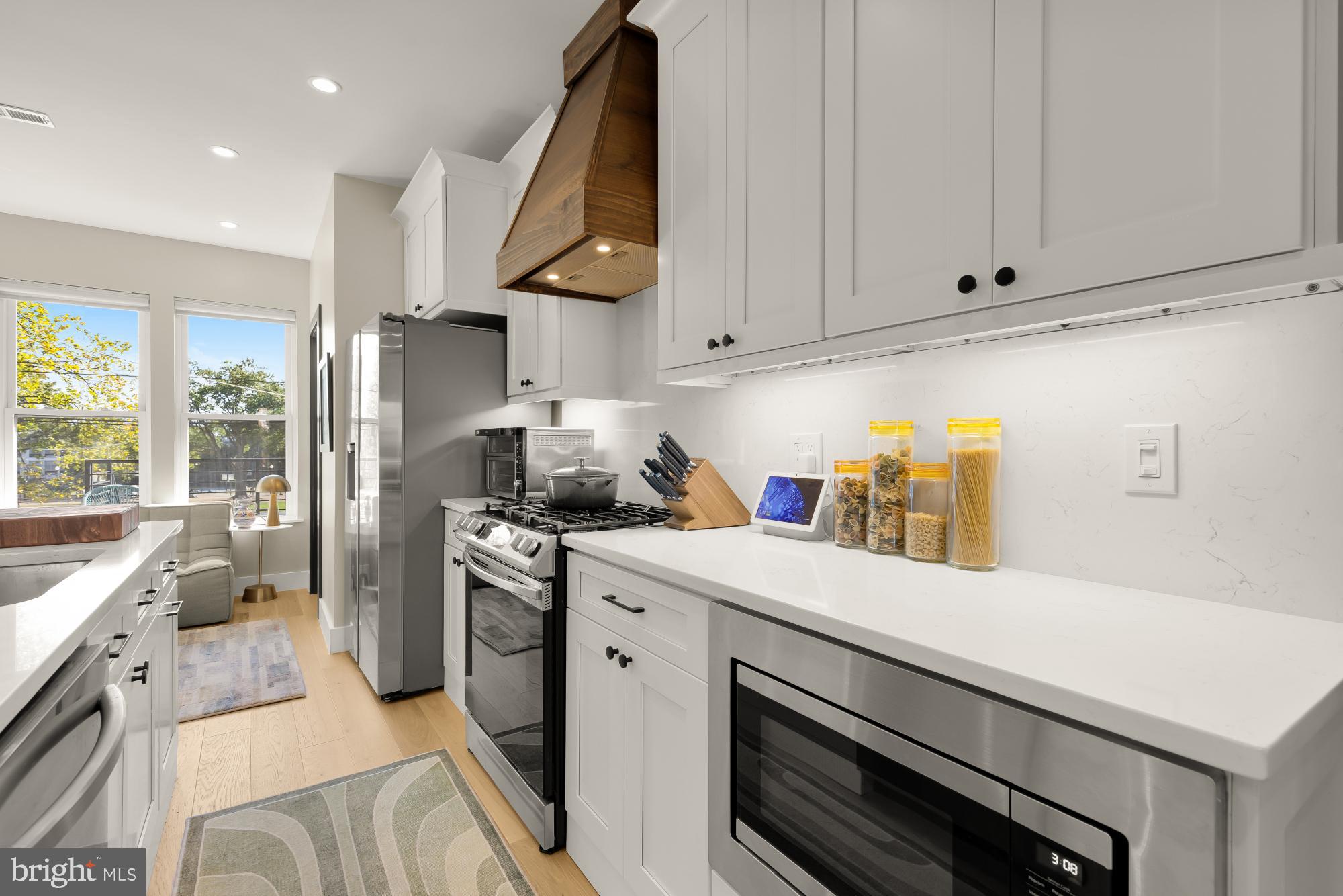 47 T Street Northeast Washington, DC 20002 - Photo 13 of 45 a kitchen with a sink a stove and cabinets