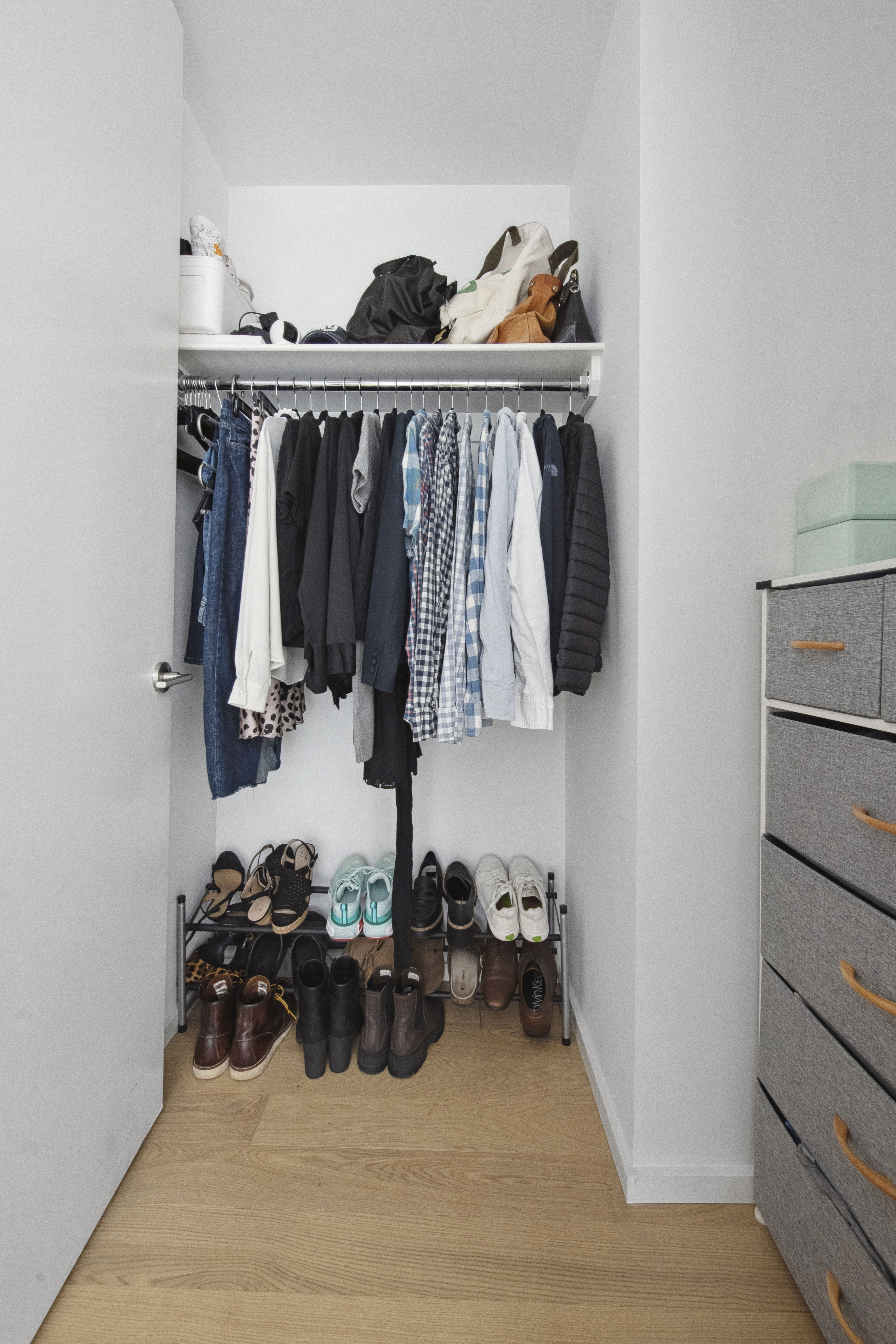 98 Front Street, Unit 9S Brooklyn, NY 11201 - Photo 5 of 12 a view of walk in closet with clothes and shoes