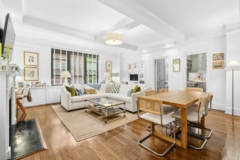 a living room with lots of furniture and a table