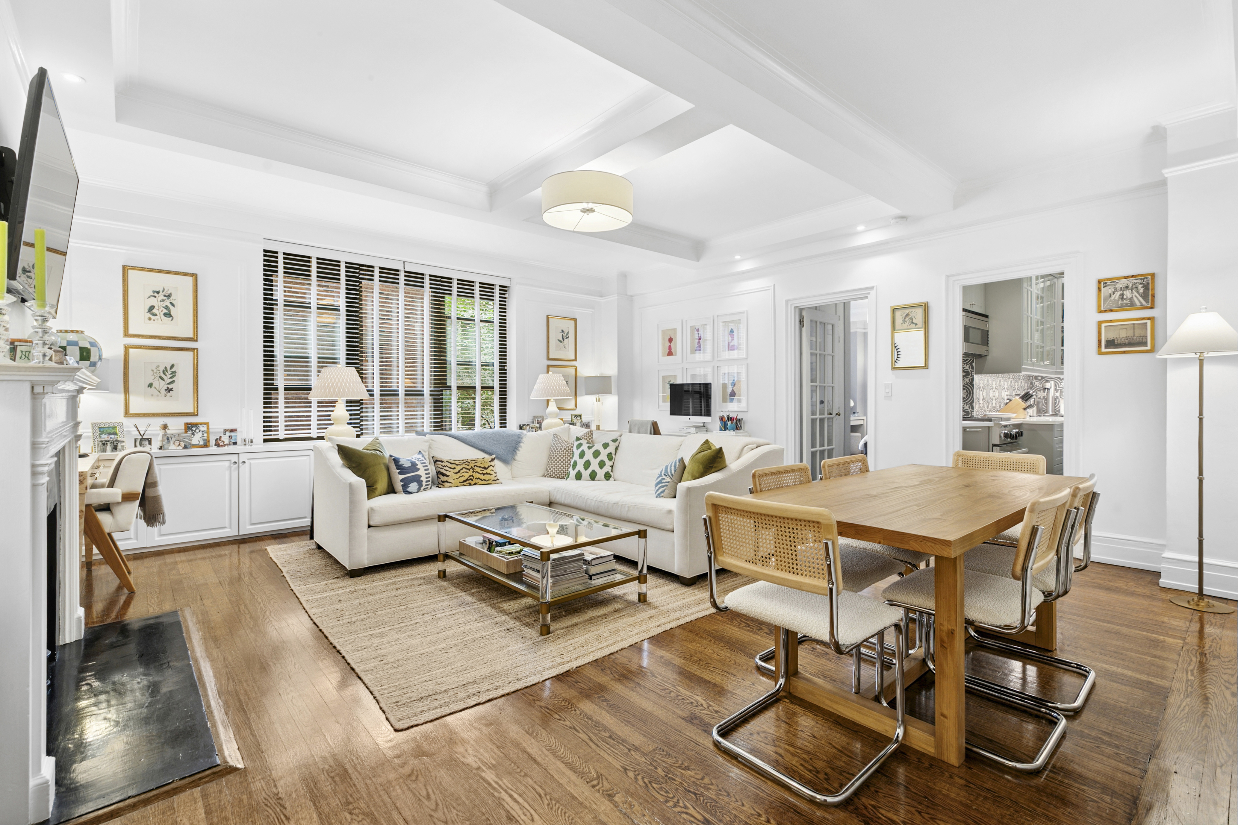 175 East 79th Street, Unit 3D Manhattan, NY 10075 - Photo 2 of 8 a living room with lots of furniture and a table