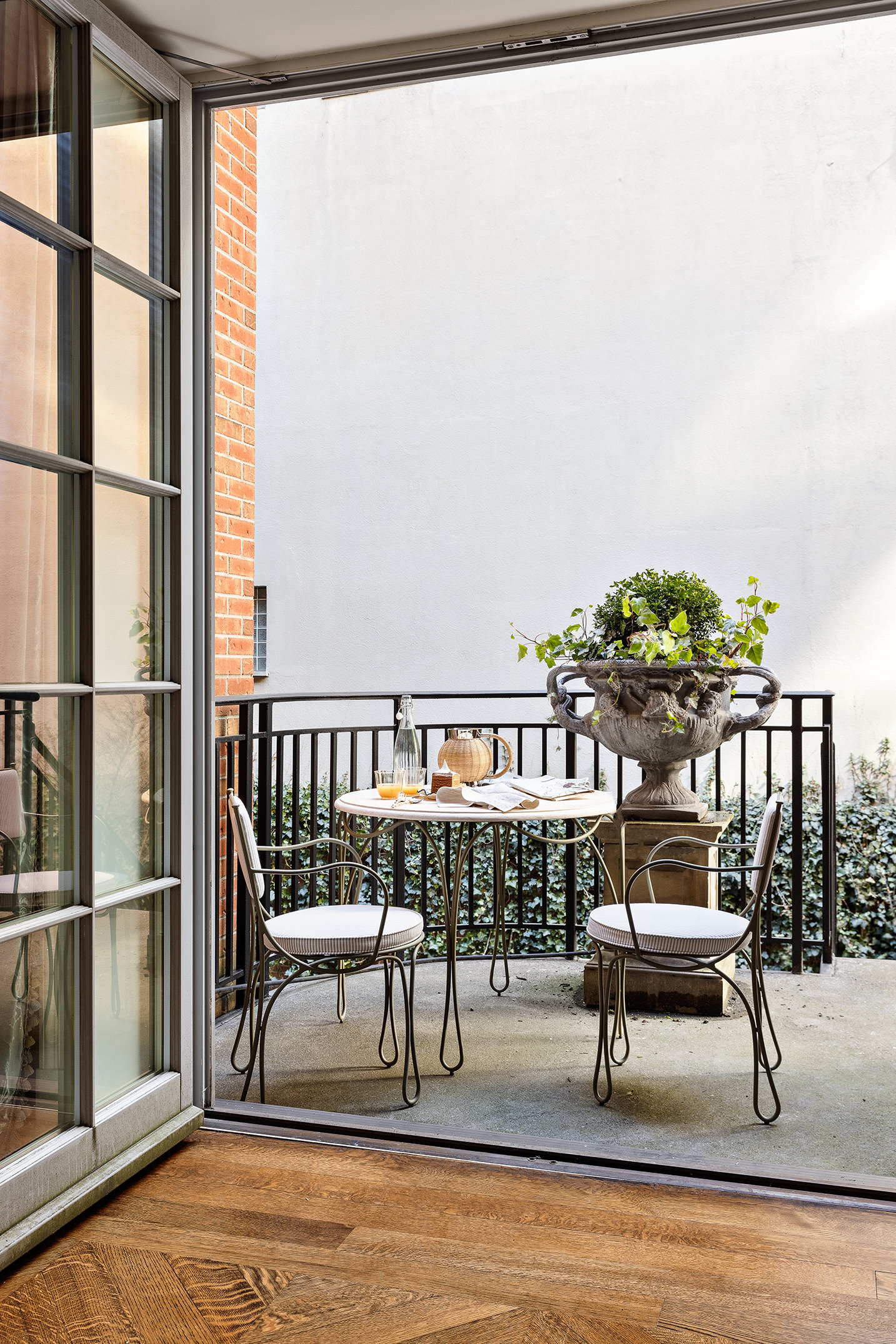 400 West 12th Street, Unit TH3 Manhattan, NY 10014 - Photo 6 of 29 a view of a chairs and table in the balcony