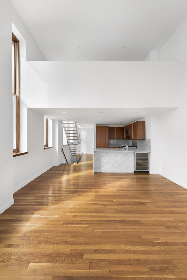 305 2nd Avenue, Unit 505 Manhattan, NY 10003 - Photo 5 of 17 a view of empty room with wooden floor