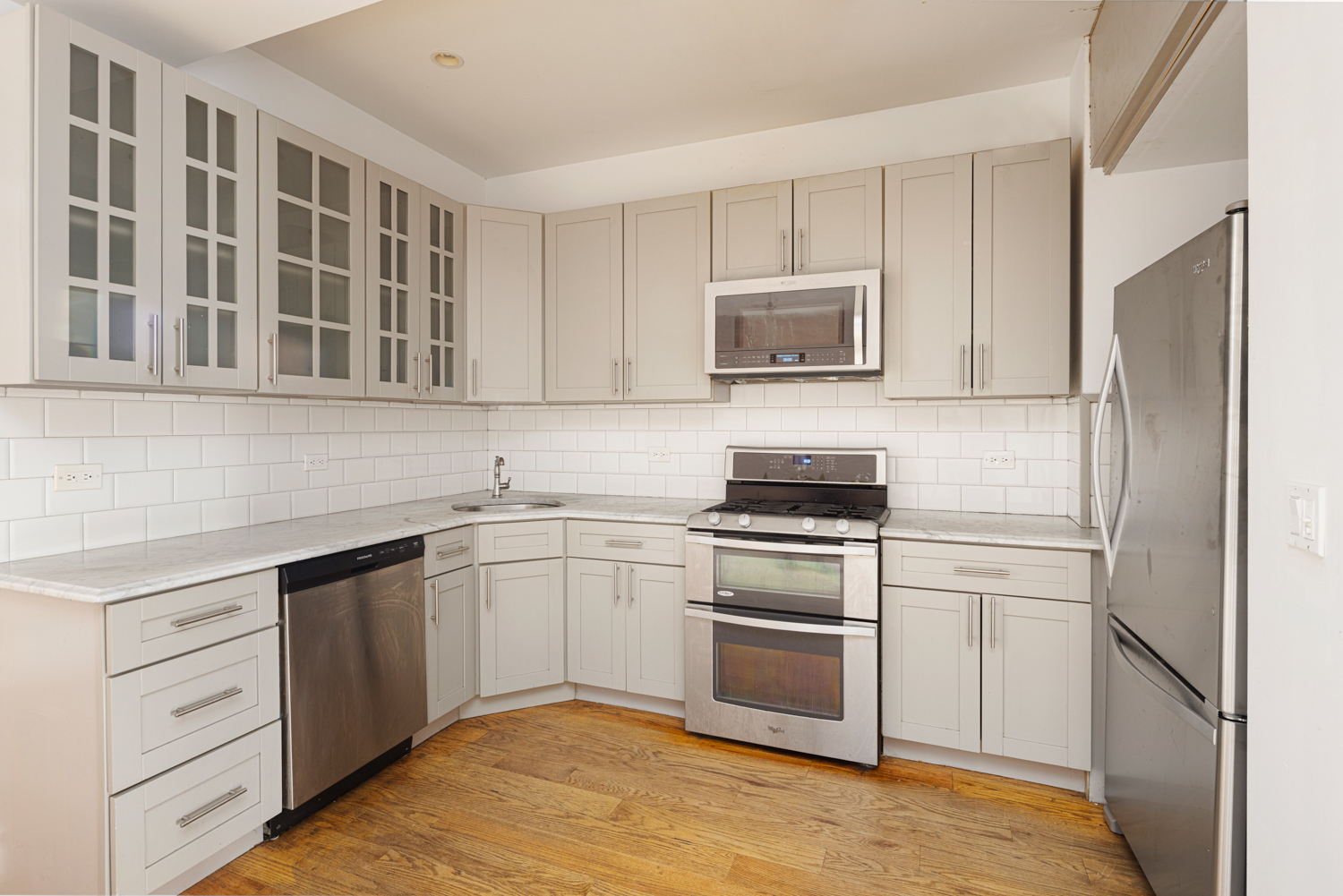 912 Eastern Parkway, Unit 1 Brooklyn, NY 11213 - Photo 4 of 11 a kitchen with cabinets stainless steel appliances and a sink