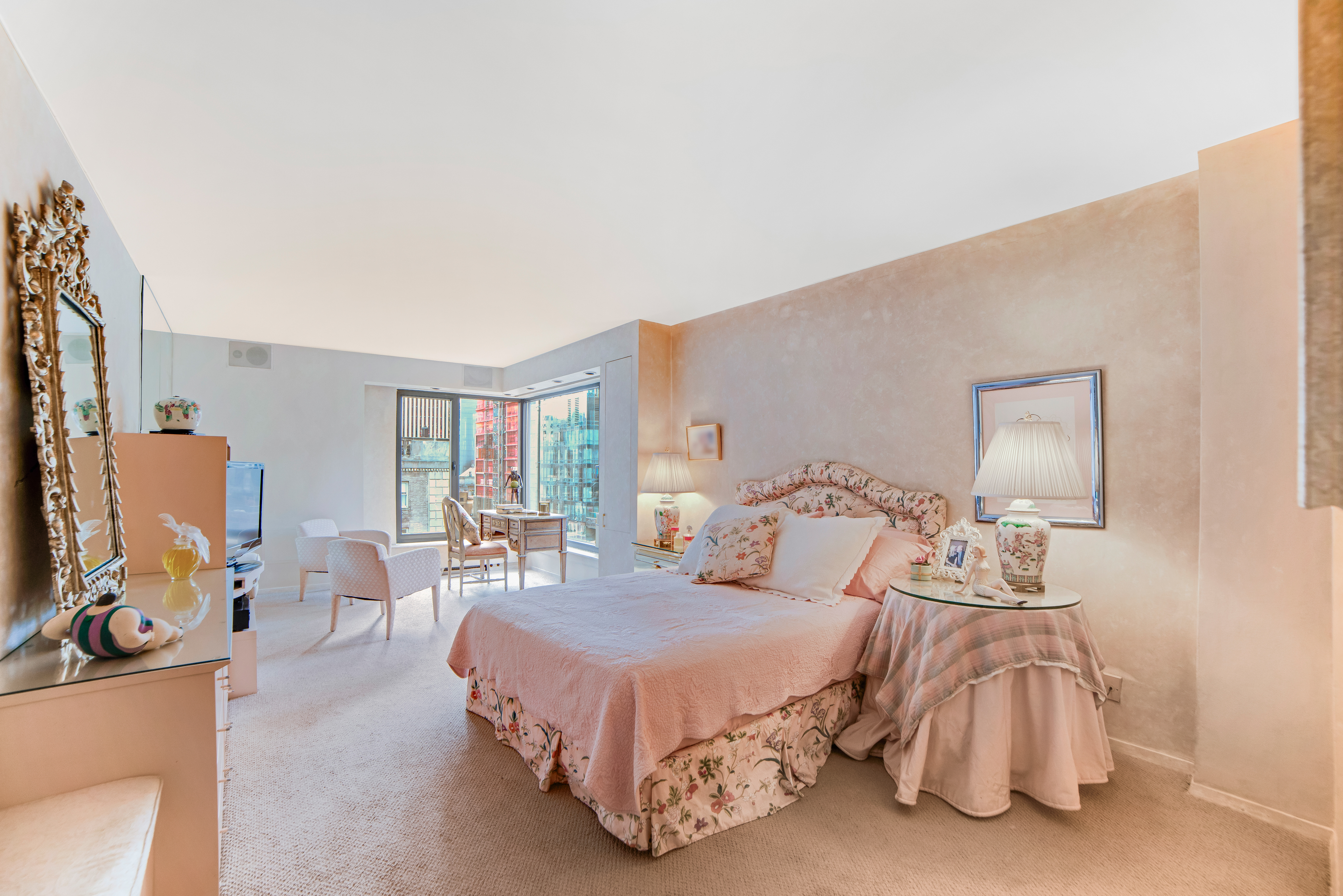 200 Central Park South, Unit 24A Manhattan, NY 10019 - Photo 19 of 23 a spacious bedroom with a bed and window