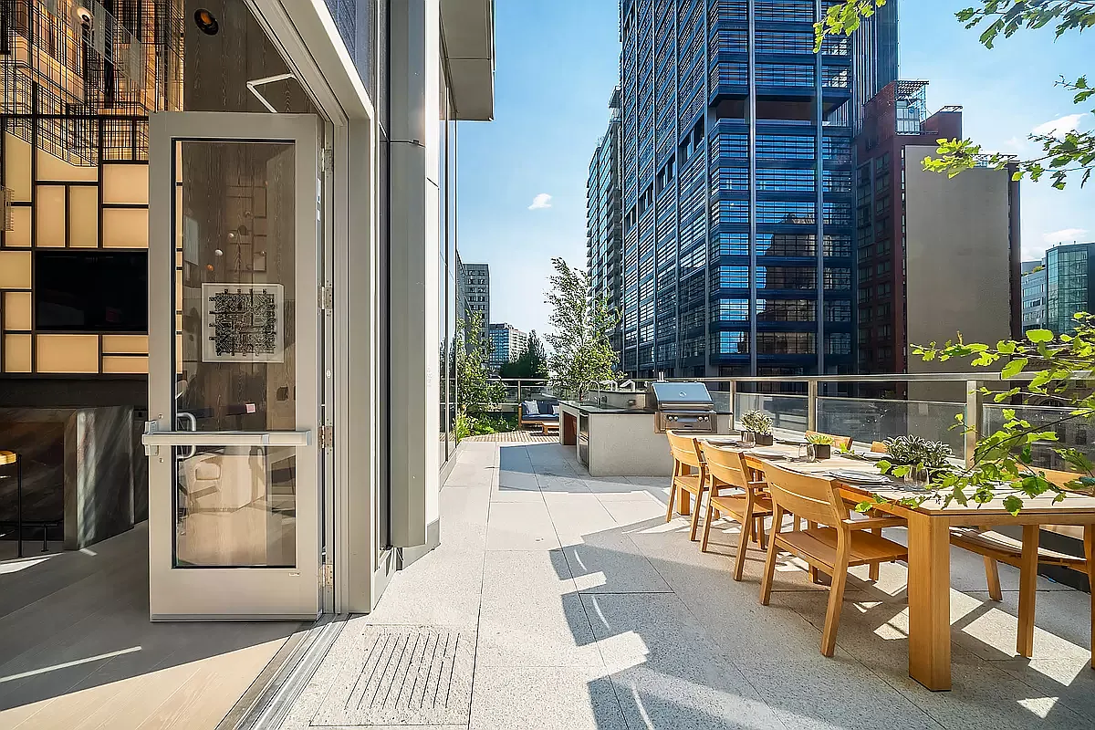 1 City Point, Unit 43H Brooklyn, NY 11201 - Photo 17 of 19 a view of a patio with dining table and chairs