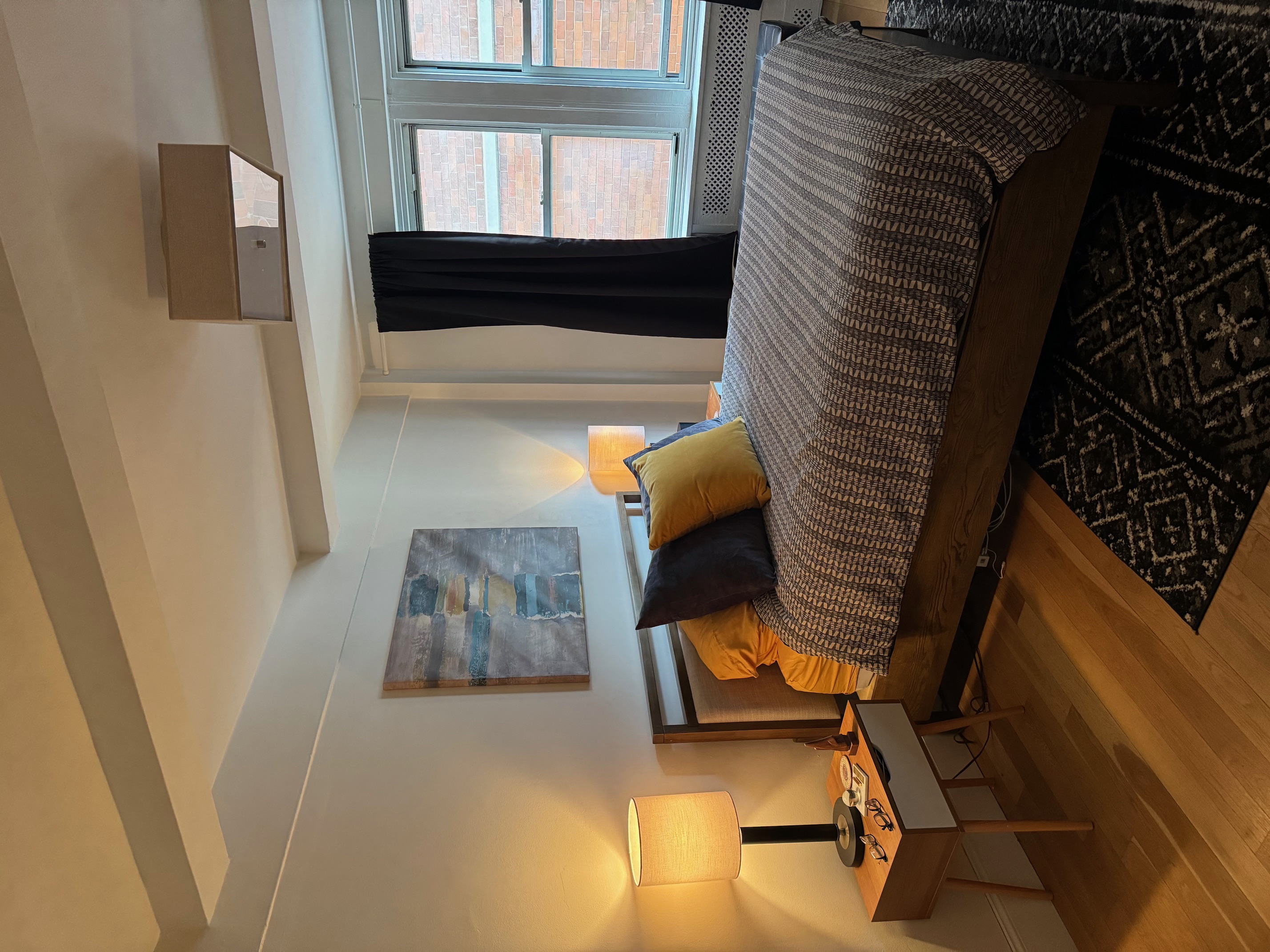 433 West 34th Street, Unit 6K Manhattan, NY 10001 - Photo 5 of 12 a bedroom with bed and window