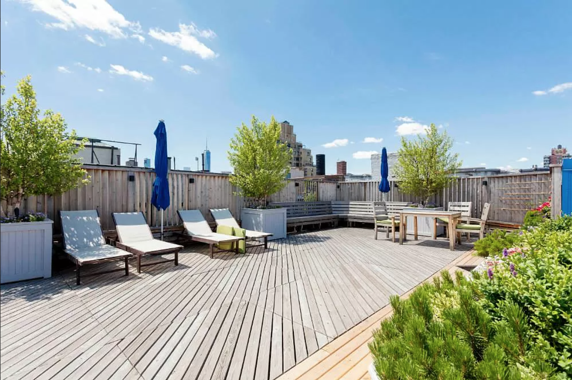 80 Charles Street, Unit 2R Manhattan, NY 10014 - Photo 5 of 5 a view of a patio with table and chairs potted plants with wooden floor