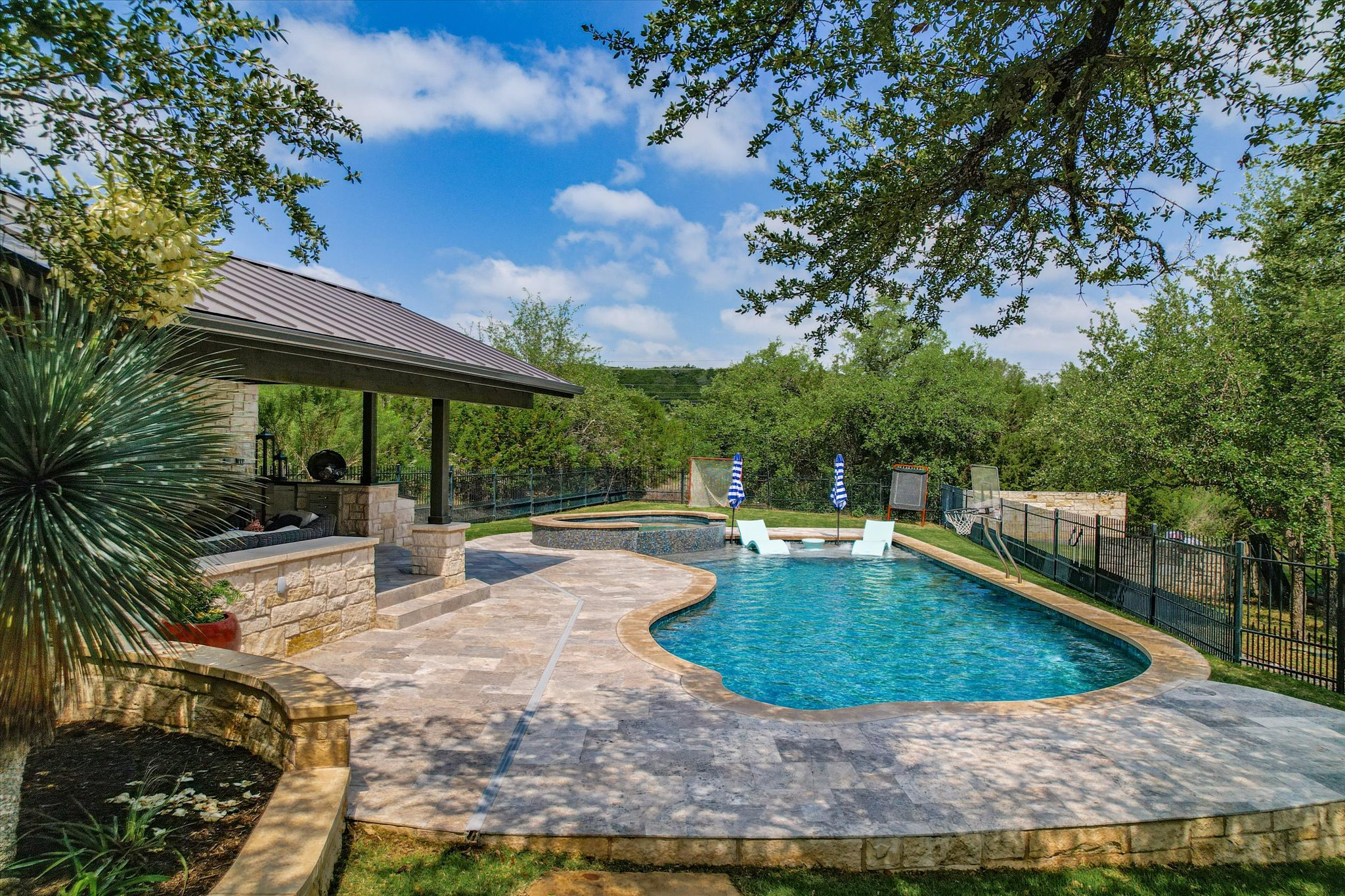 1422 Palomino Ridge Drive Austin, TX 78733 - Photo 51 of 60 a view of a swimming pool with a patio