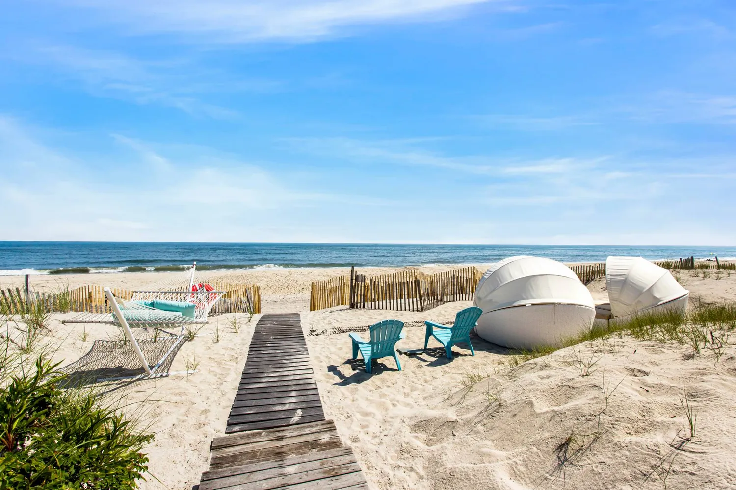 a roof deck with a couch and wooden floor
