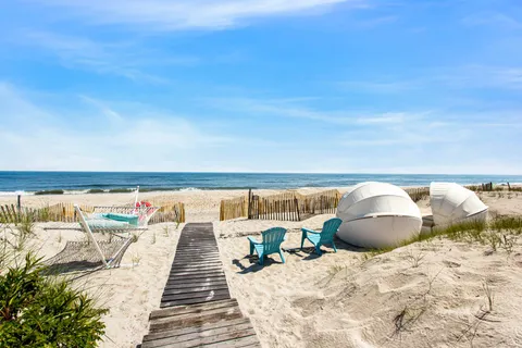 a roof deck with a couch and wooden floor