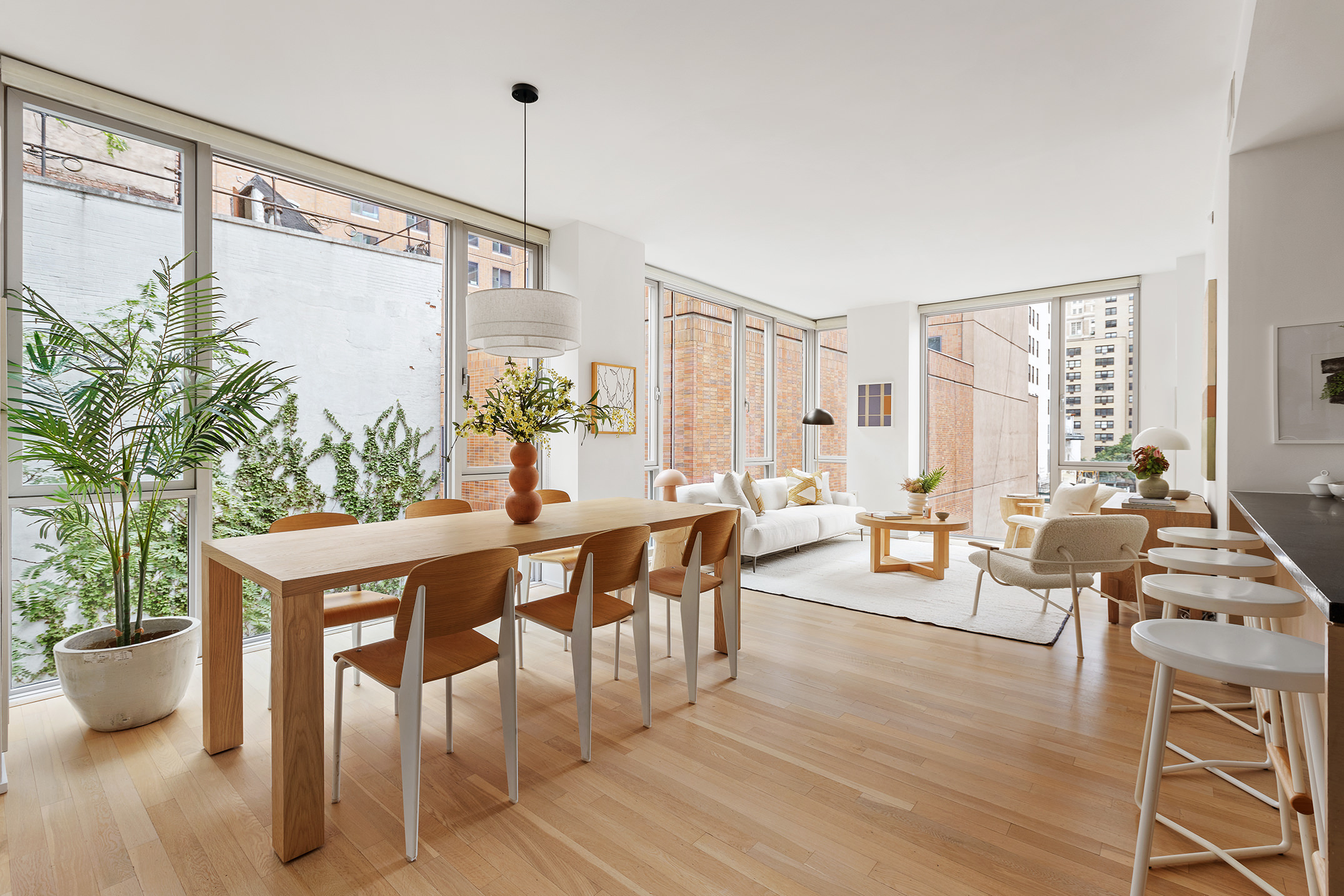 110 3rd Avenue, Unit 4B Manhattan, NY 10003 - Photo 3 of 15 a view of a dining room with furniture window and wooden floor
