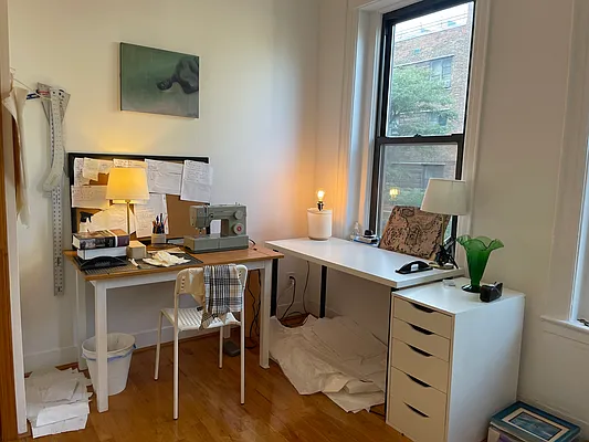 314 East 11th Street, Unit 3A Manhattan, NY 10003 - Photo 2 of 6 a view of a workspace with furniture and a window
