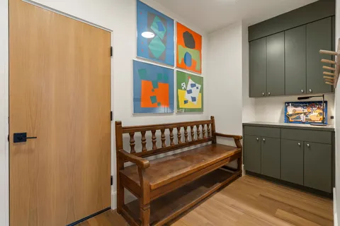 a view of a balcony with floor to ceiling window wooden floor