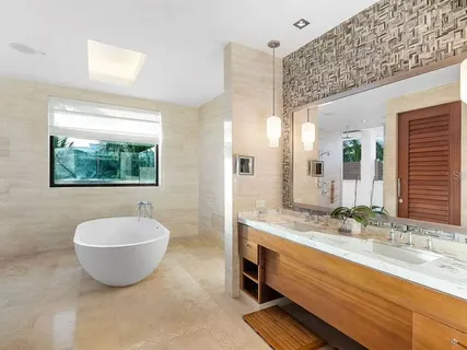 a spacious bathroom with a granite countertop sink and a mirror