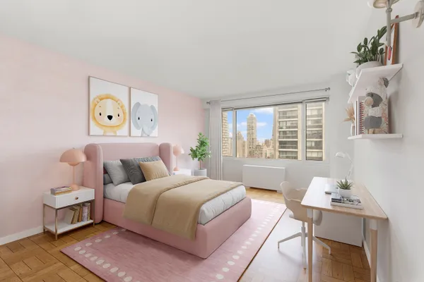 a living room with stainless steel appliances wooden floor and large windows