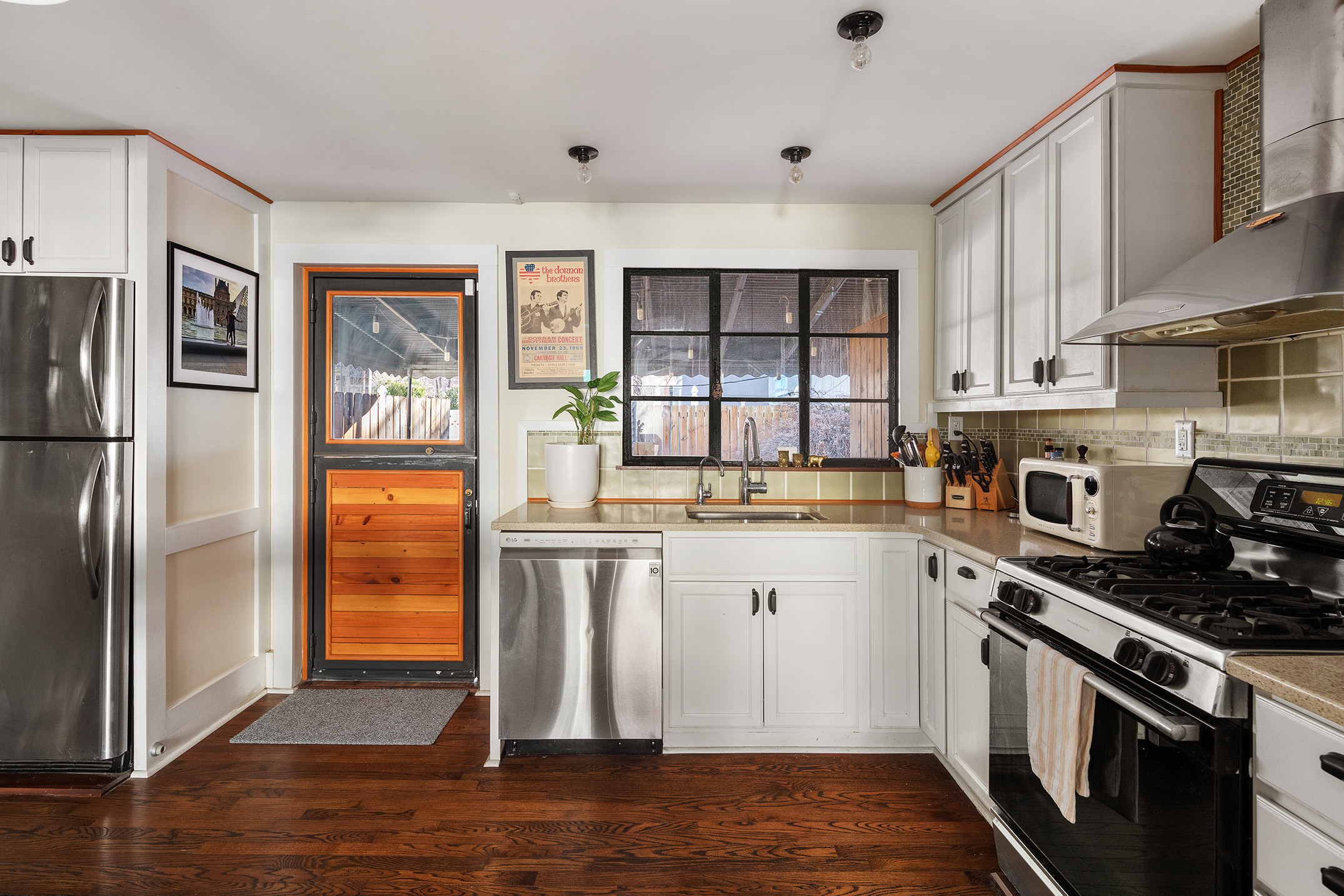 214 Withers Street Brooklyn, NY 11211 - Photo 3 of 10 a kitchen with stainless steel appliances granite countertop a refrigerator sink and stove