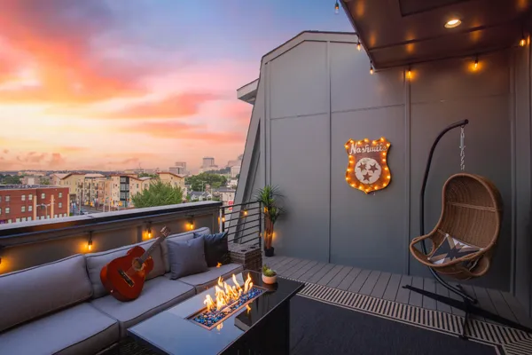 an outdoor living room with furniture