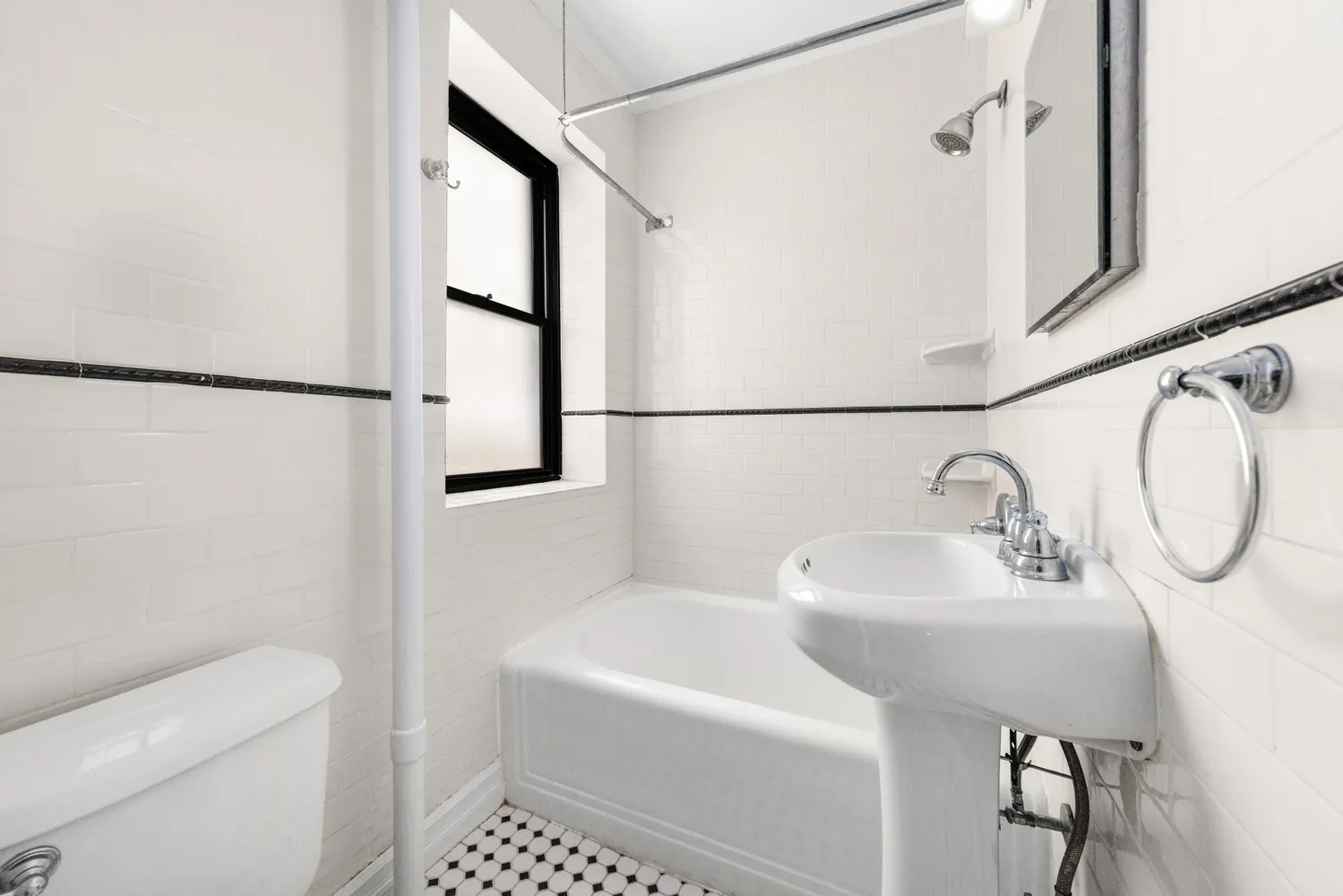 a bathroom with a sink toilet and a mirror