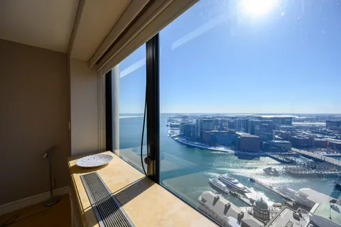 a view of a balcony with chair and table