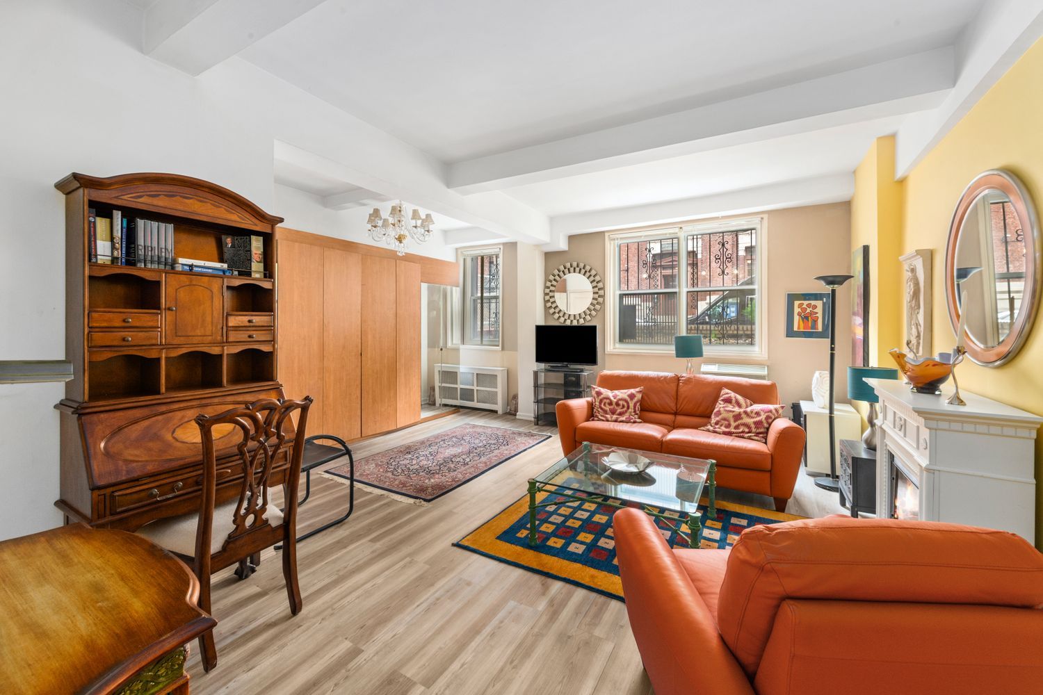 345 East 54th Street Manhattan, NY 10022 - Photo 2 of 10 a living room with furniture a rug and a window