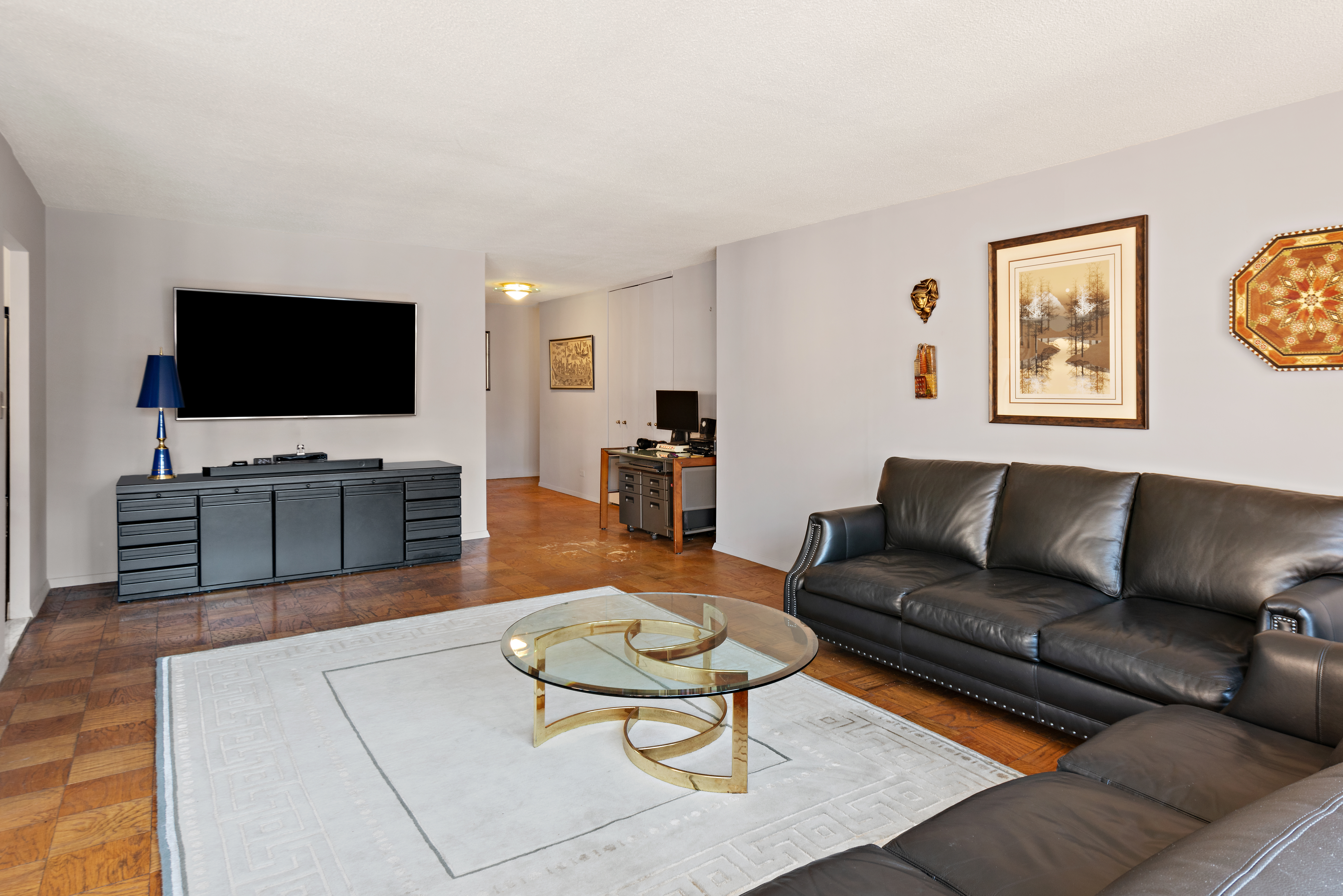 a living room with furniture and a flat screen tv