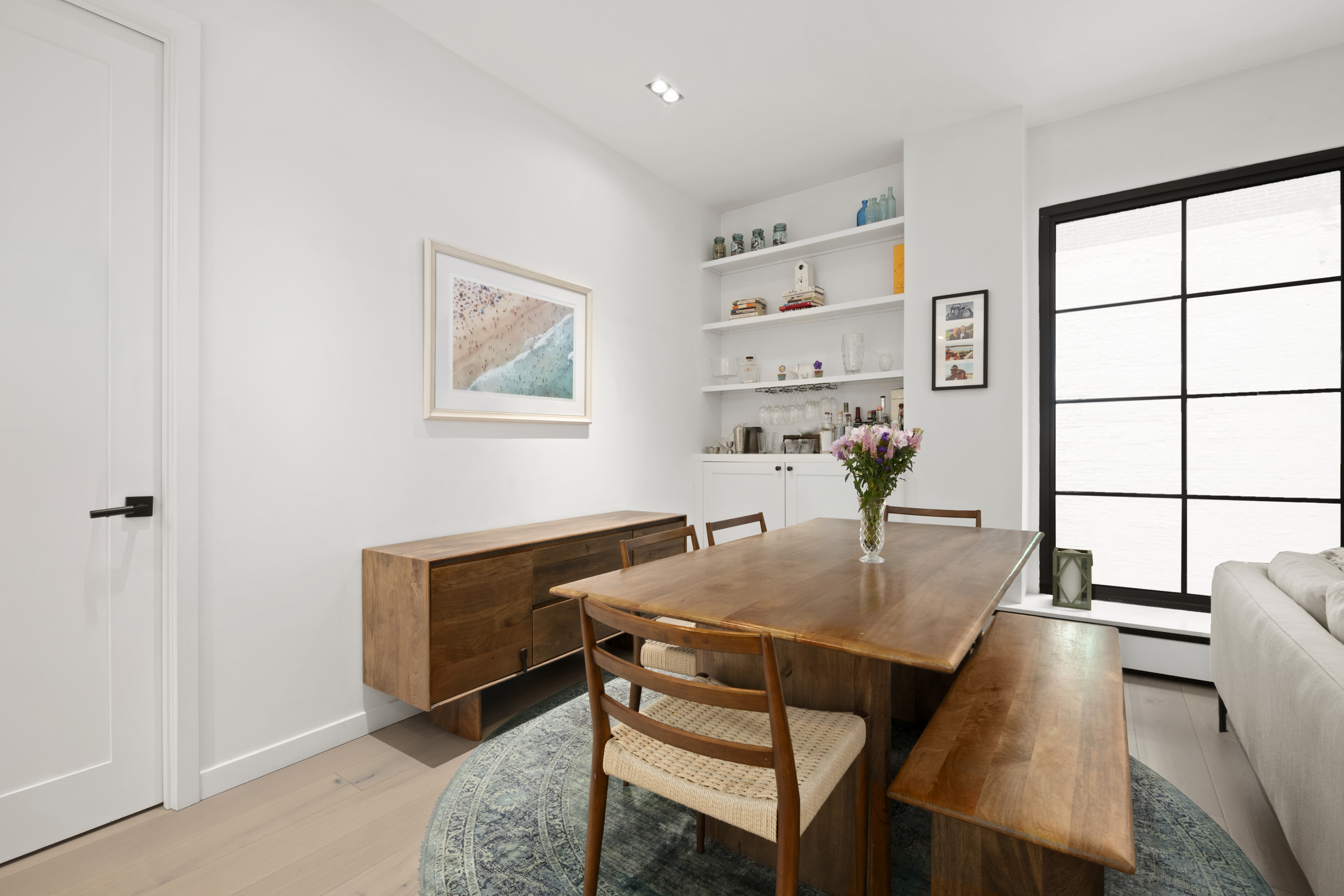 225 West 17th Street, Unit 6B Manhattan, NY 10011 - Photo 4 of 11 a view of a dining room with furniture and window