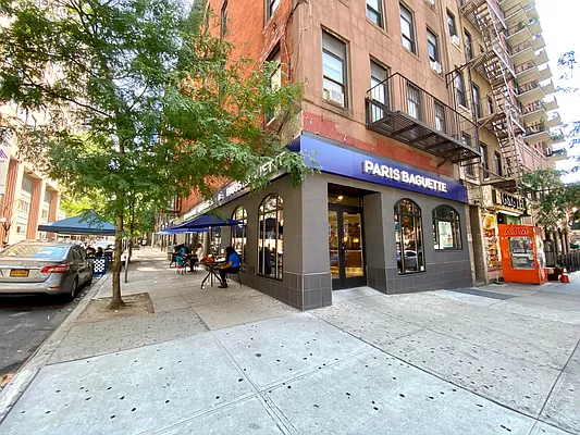 421 West 57th Street, Unit 3C Manhattan, NY 10019 - Photo 11 of 18 a view of a building with car parked