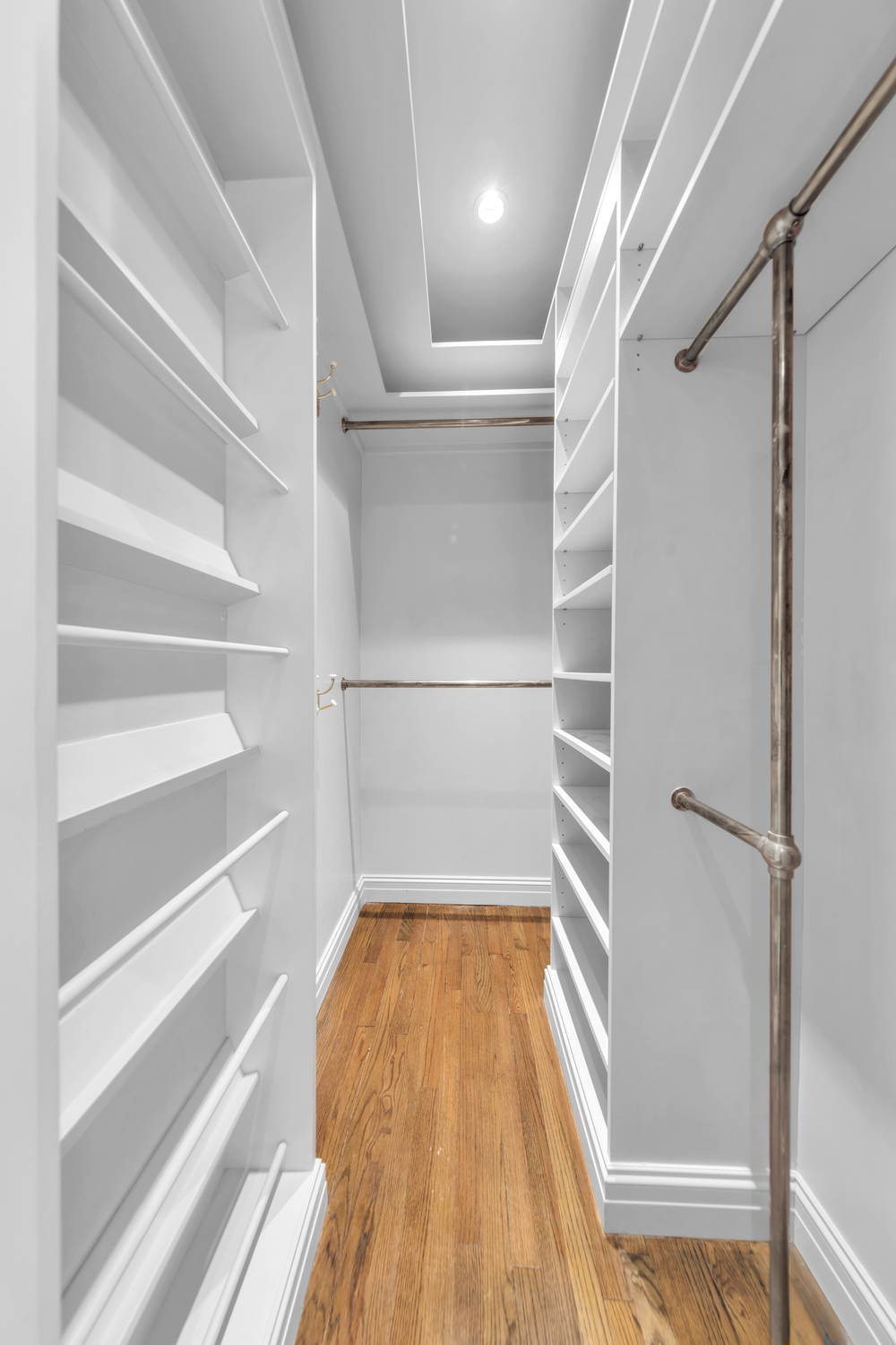 465 Park Avenue, Unit 34E Manhattan, NY 10022 - Photo 15 of 18 a view of walk in closet with empty racks