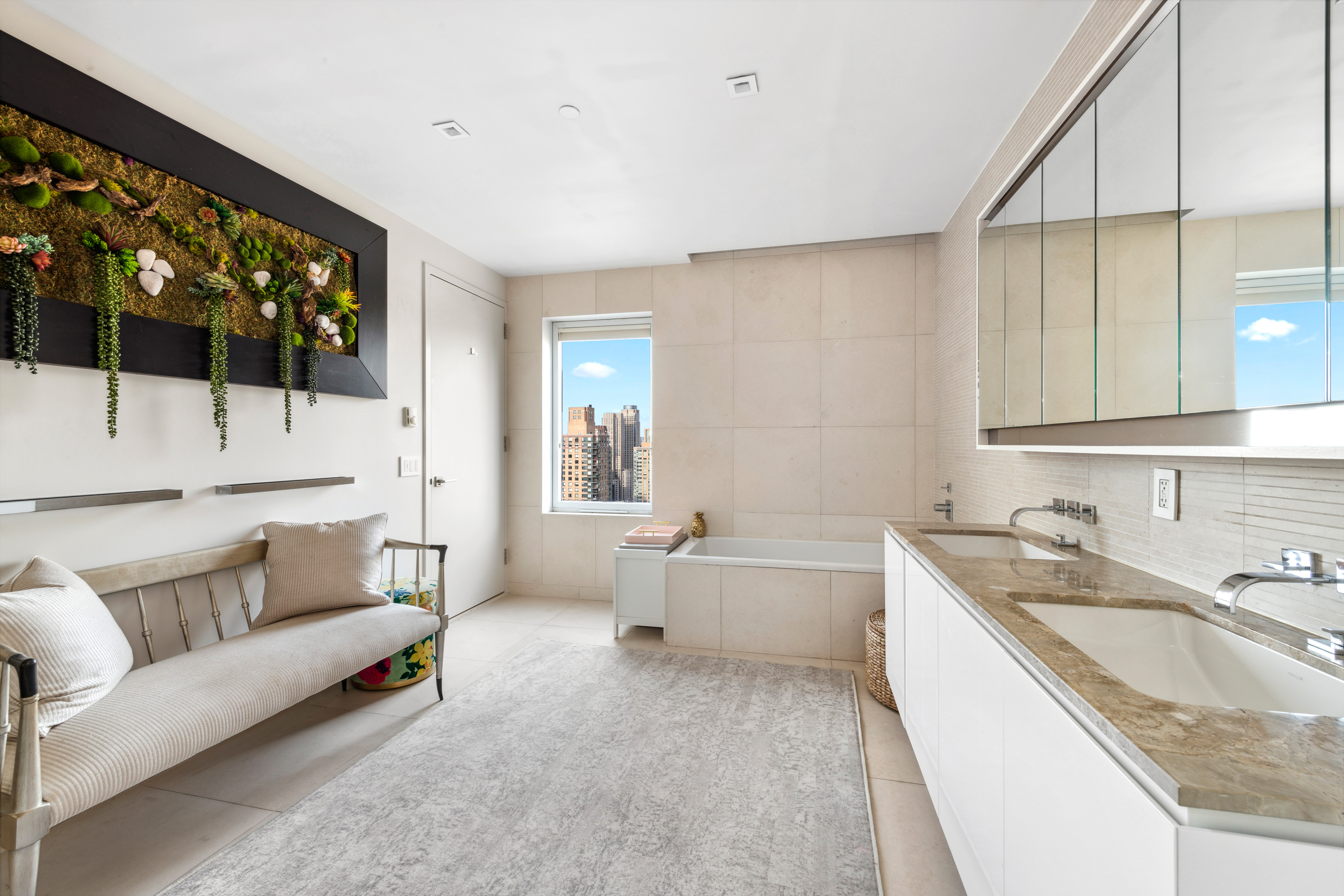 555 West 59th Street, Unit PHA Manhattan, NY 10019 - Photo 11 of 20 a bathroom with a granite countertop double vanity sink and a bathtub