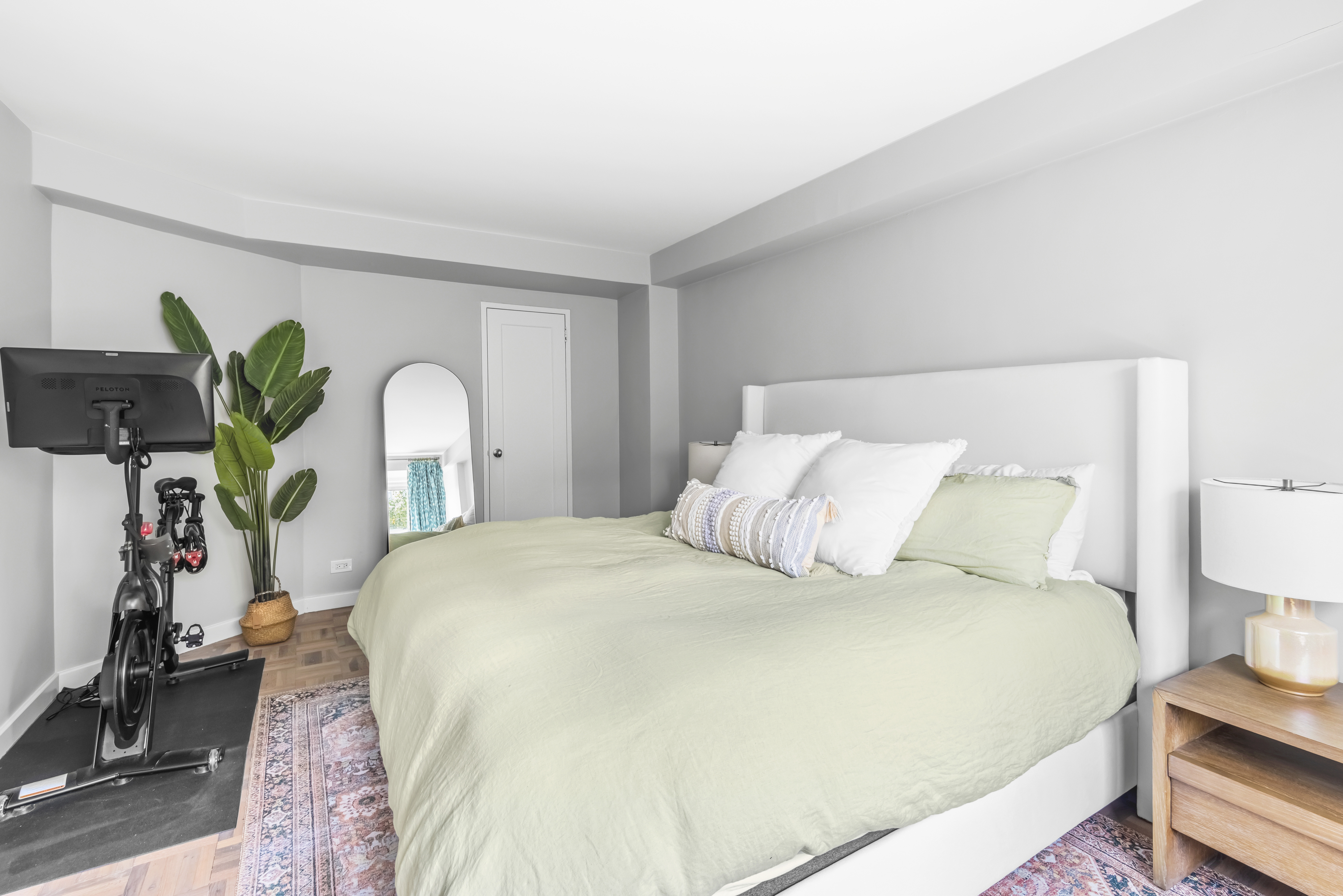 2 Charlton Street, Unit 5A Manhattan, NY 10014 - Photo 9 of 12 a large bed sitting in a bedroom and a table