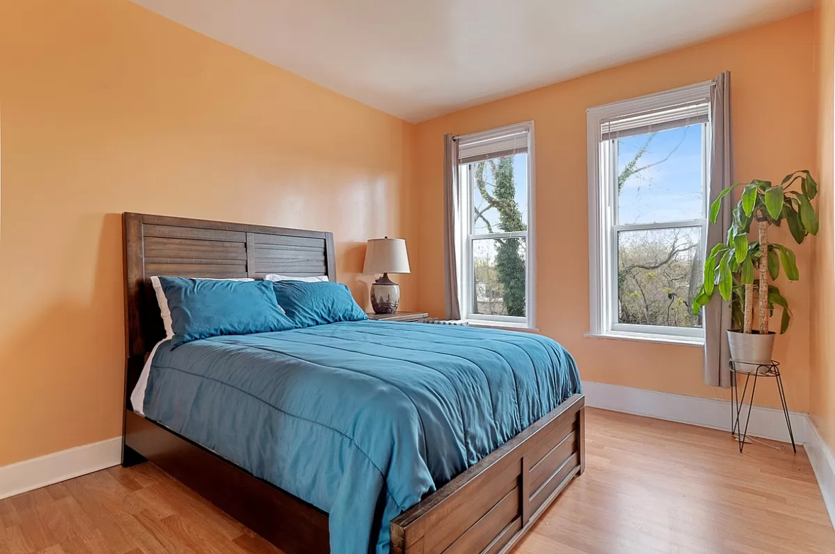1688 Carroll Street, Unit 2 Brooklyn, NY 11213 - Photo 1 of 9 a bedroom with a large bed and a window