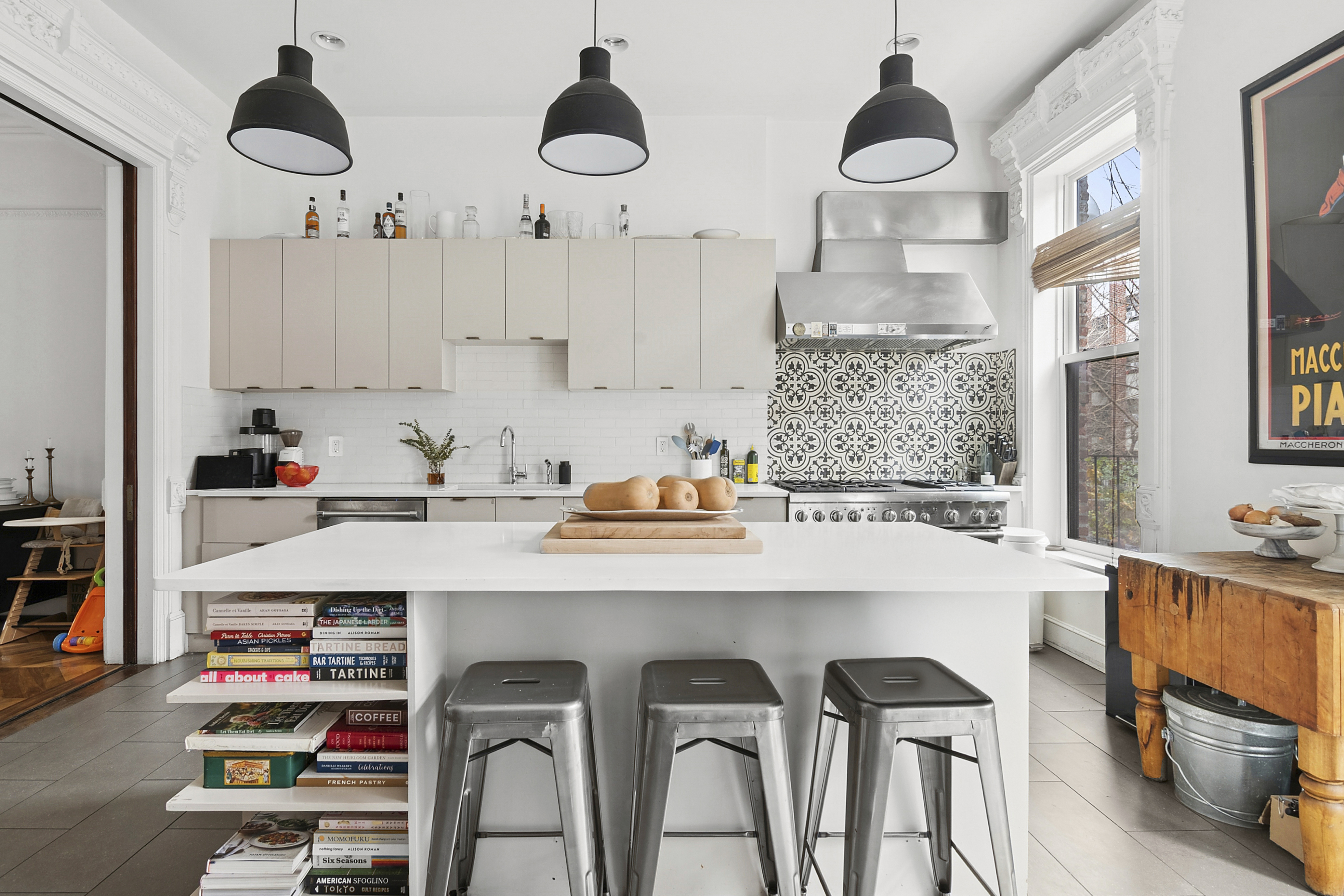 581 Greene Avenue, Unit 2 Brooklyn, NY 11216 - Photo 3 of 16 a kitchen with kitchen island stainless steel appliances a sink a stove and a refrigerator