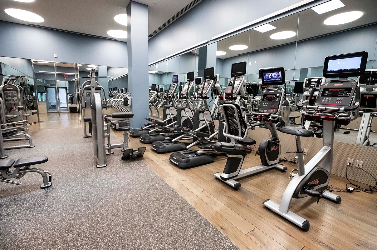 25 Broad Street, Unit 16I Manhattan, NY 10004 - Photo 18 of 23 a view of a room with gym equipment