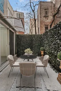 a view of a patio with couple of chairs